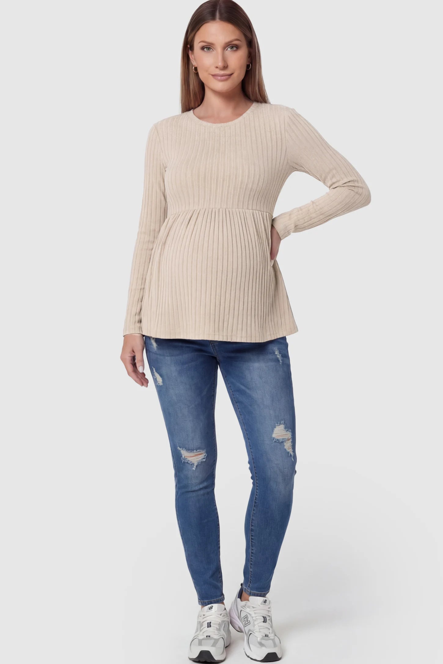 Ribbed Knit Long Sleeve Maternity Top Ribbed Knit Long Sleeve Maternity Top in Beige featuring an empire waist and high-stretch fabric on a pregnant model.