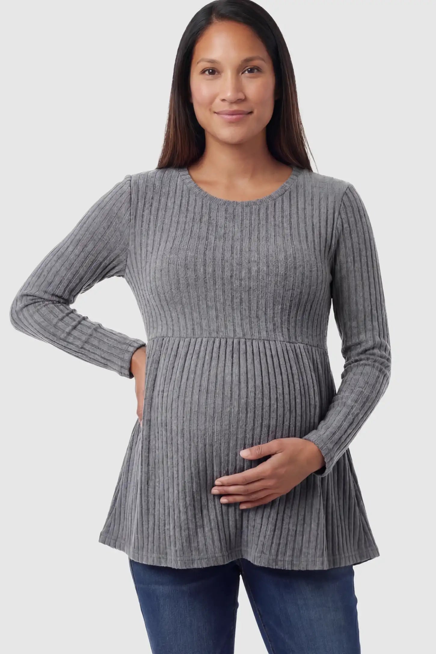 Ribbed Knit Long Sleeve Maternity Top Ribbed Knit Long Sleeve Maternity Top in Dark Gray featuring an empire waist and high-stretch fabric on a pregnant model posing front.