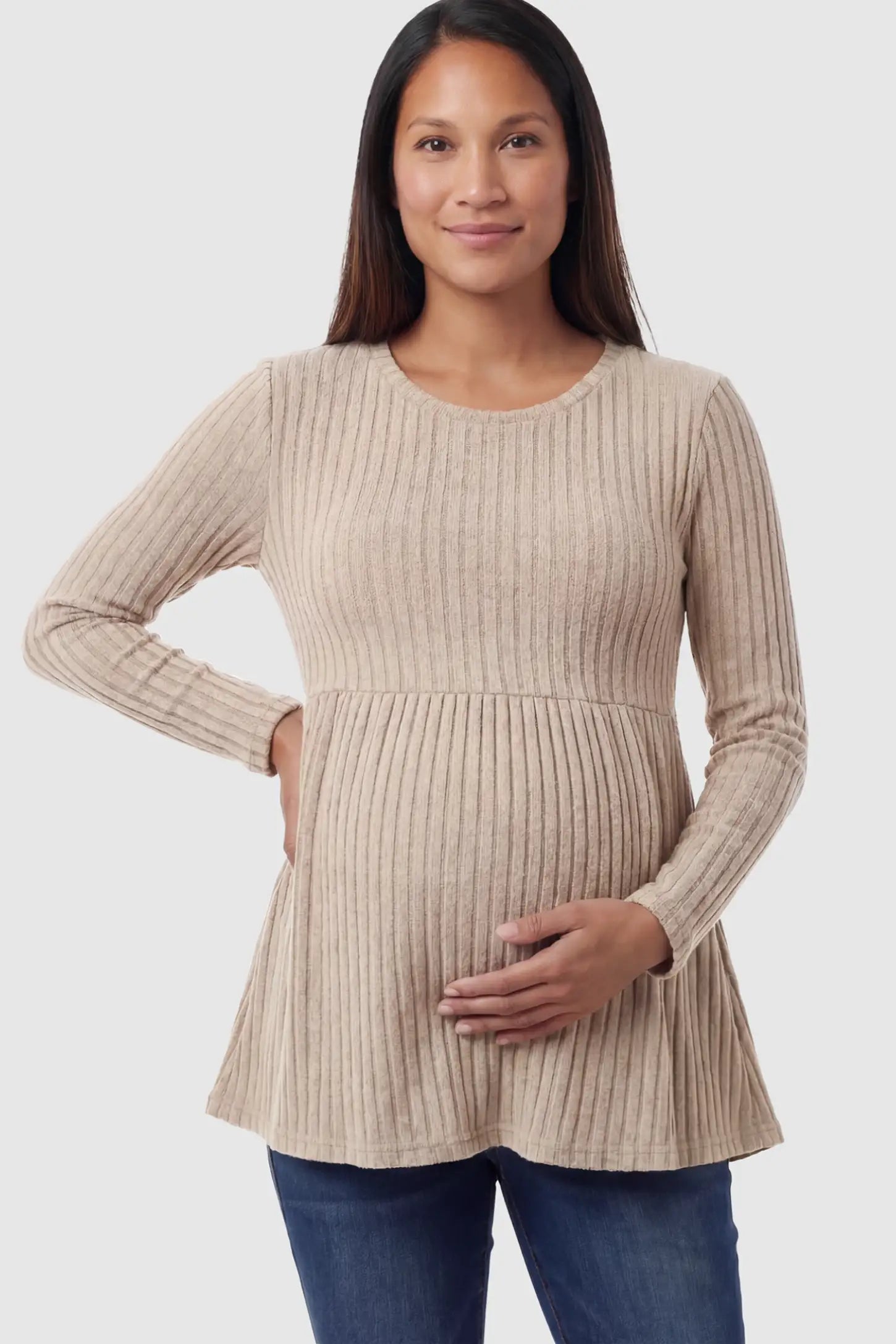 Ribbed Knit Long Sleeve Maternity Top Ribbed Knit Long Sleeve Maternity Top in Khali featuring an empire waist and high-stretch fabric on a pregnant model posing front.