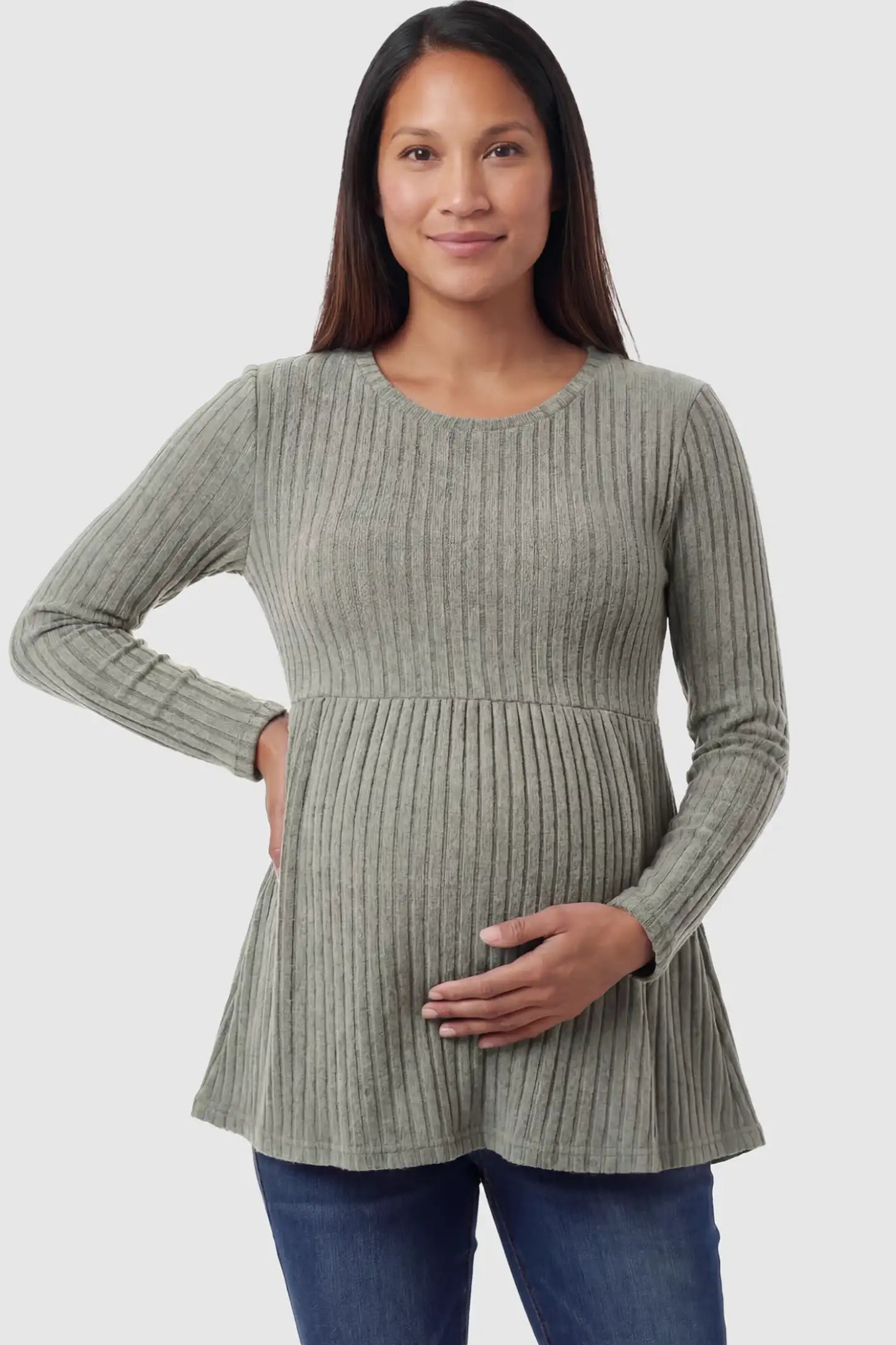 Ribbed Knit Long Sleeve Maternity Top Ribbed Knit Long Sleeve Maternity Top in Olive Green featuring an empire waist and high-stretch fabric on a pregnant model posing front.
