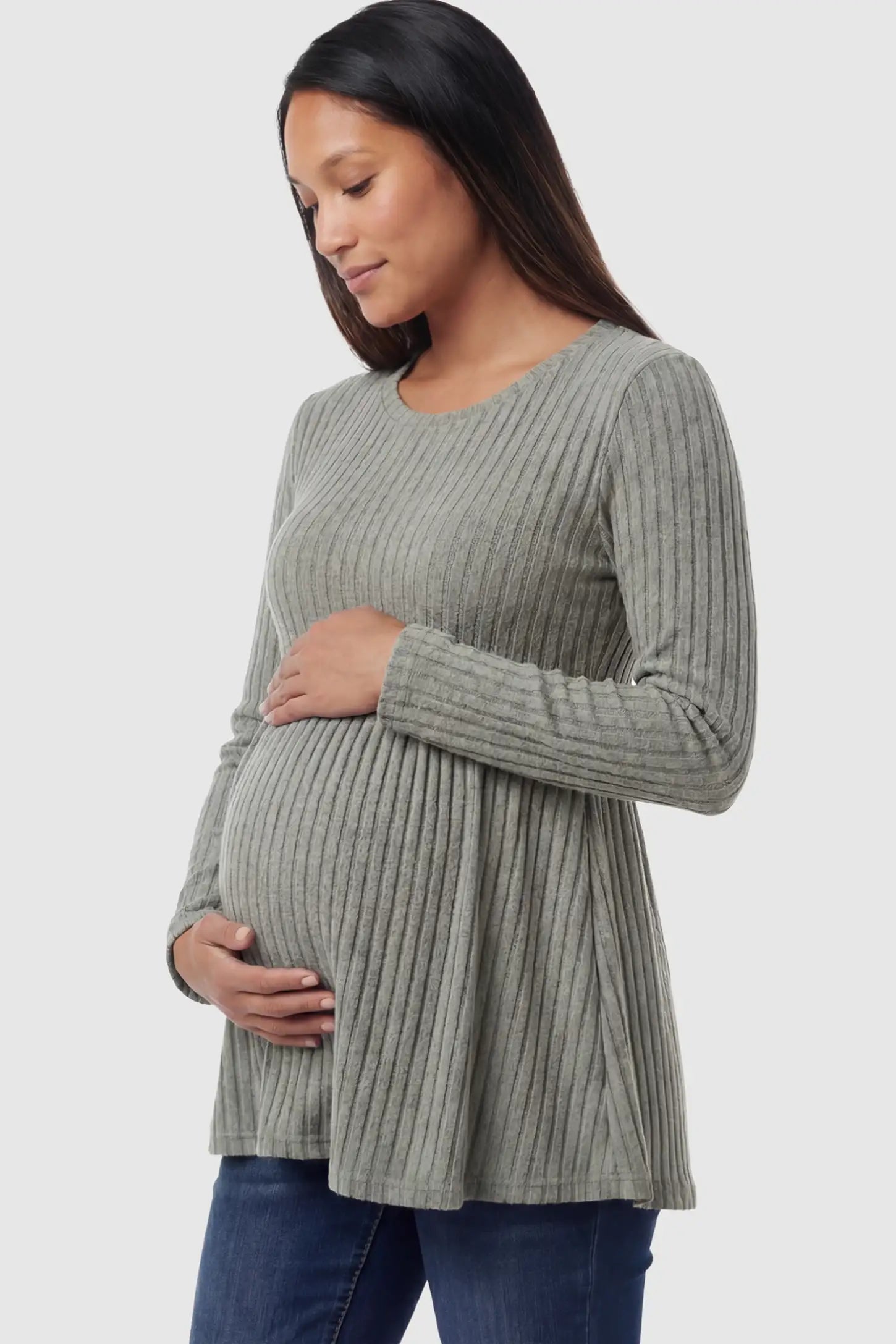 Ribbed Knit Long Sleeve Maternity Top Ribbed Knit Long Sleeve Maternity Top in Olive Green featuring an empire waist and high-stretch fabric on a pregnant model showing side.