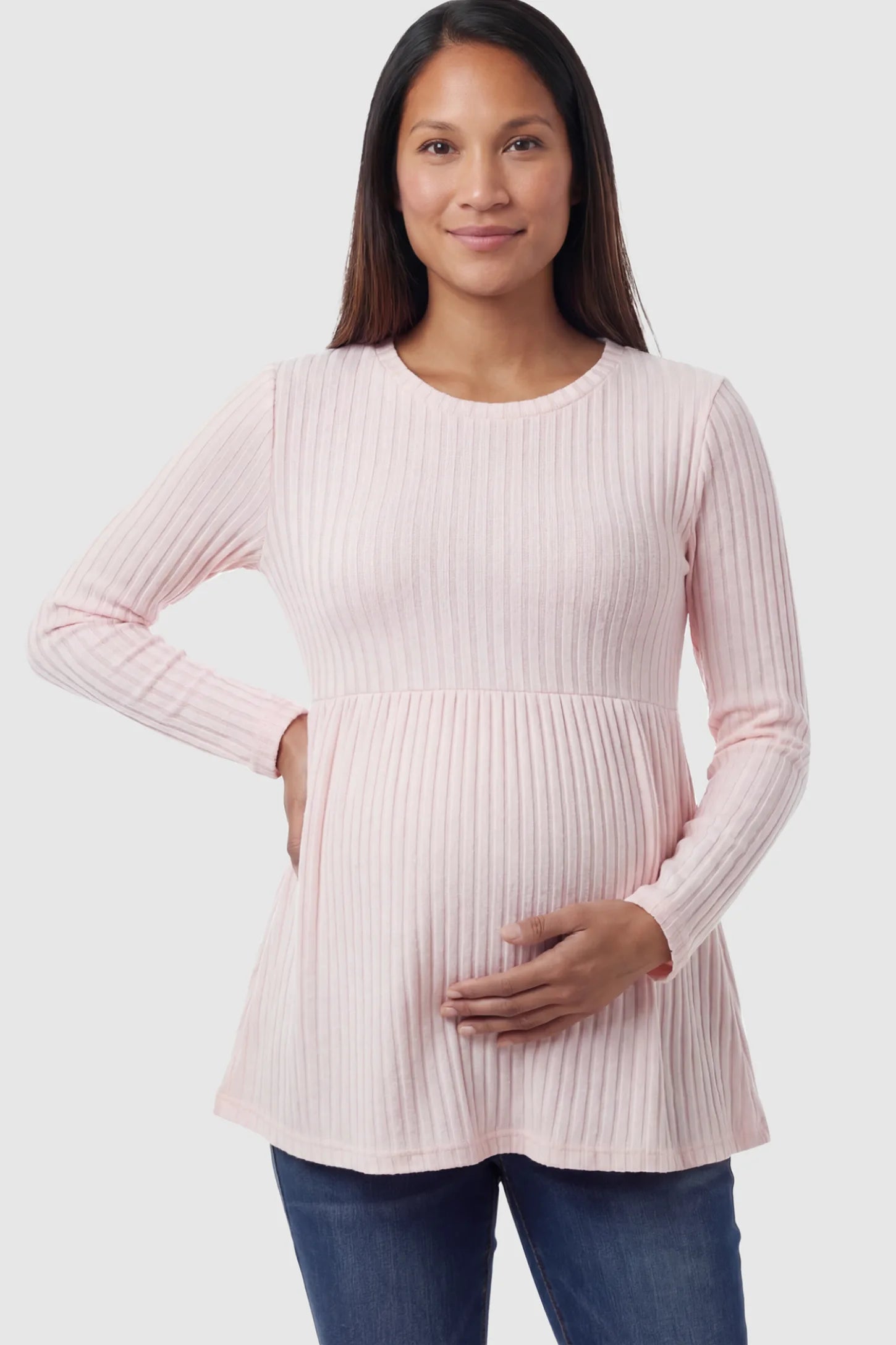 Ribbed Knit Long Sleeve Maternity Top Ribbed Knit Long Sleeve Maternity Top in Pink featuring an empire waist and high-stretch fabric on a pregnant model posing front.
