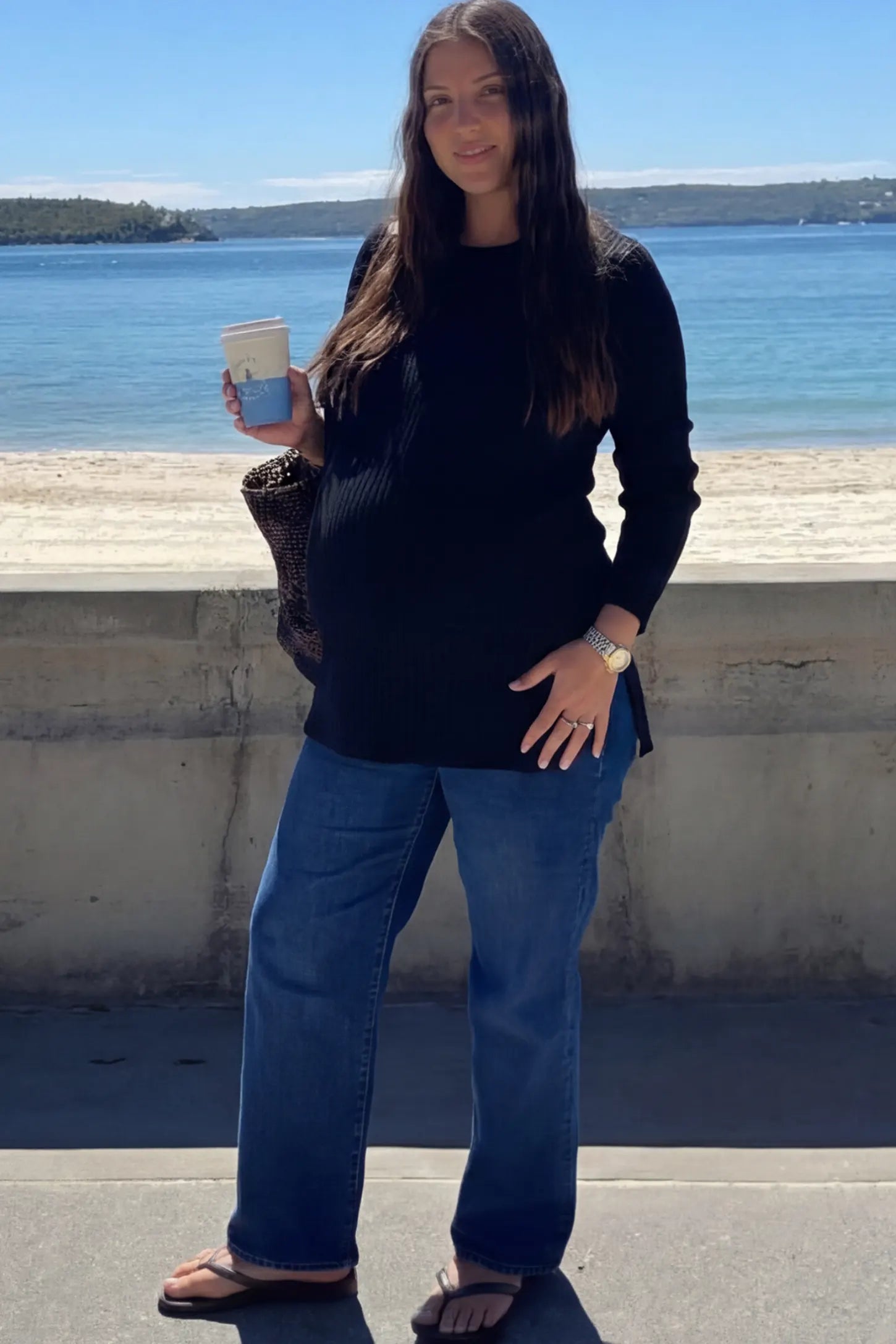 Ribbed Knit Long Sleeve Side Slit Maternity Top Ribbed Knit Side Slit Maternity Top in Black featuring high-stretch fabric and tunic length on a pregnant woman.