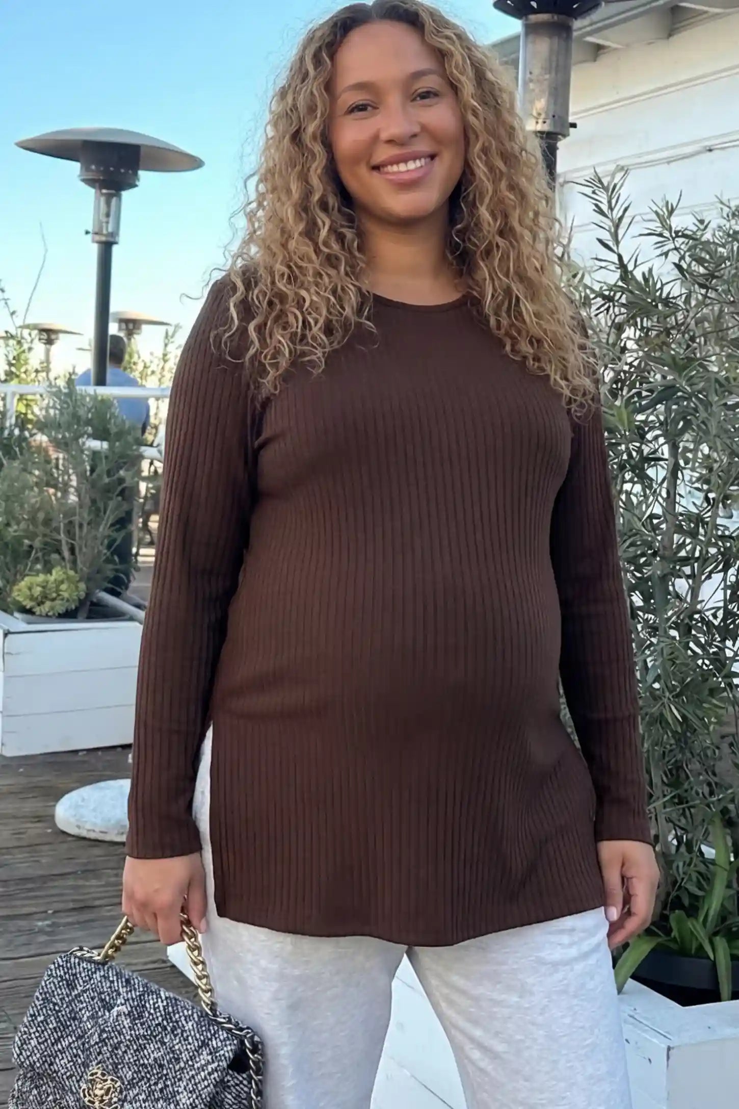 Ribbed Knit Long Sleeve Side Slit Maternity Top Ribbed Knit Side Slit Maternity Top in Dark Brown featuring high-stretch fabric and tunic length on a pregnant woman.