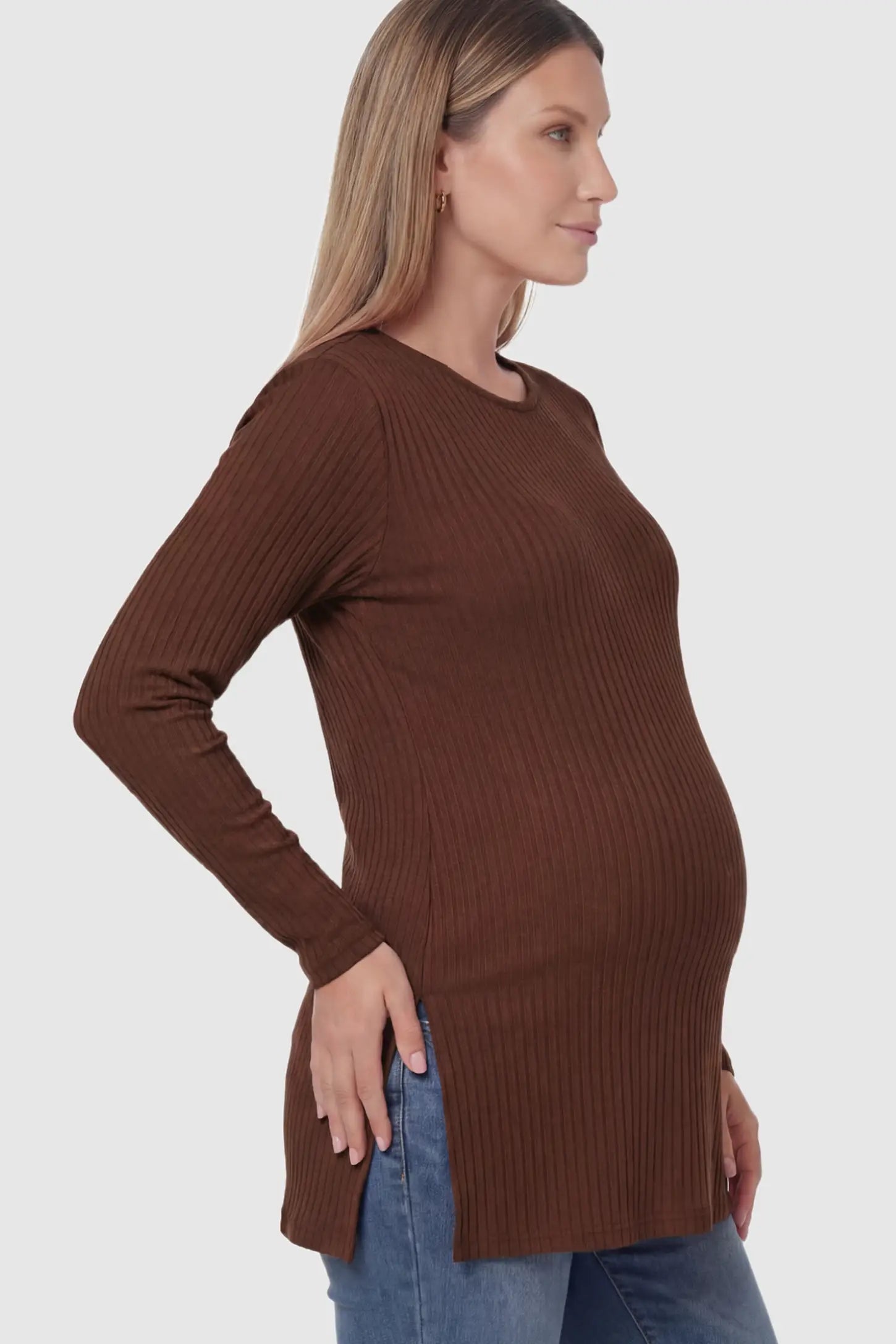 Ribbed Knit Long Sleeve Side Slit Maternity Top Ribbed Knit Side Slit Maternity Top in Dark Brown featuring high-stretch fabric and tunic length on a pregnant model showing side.