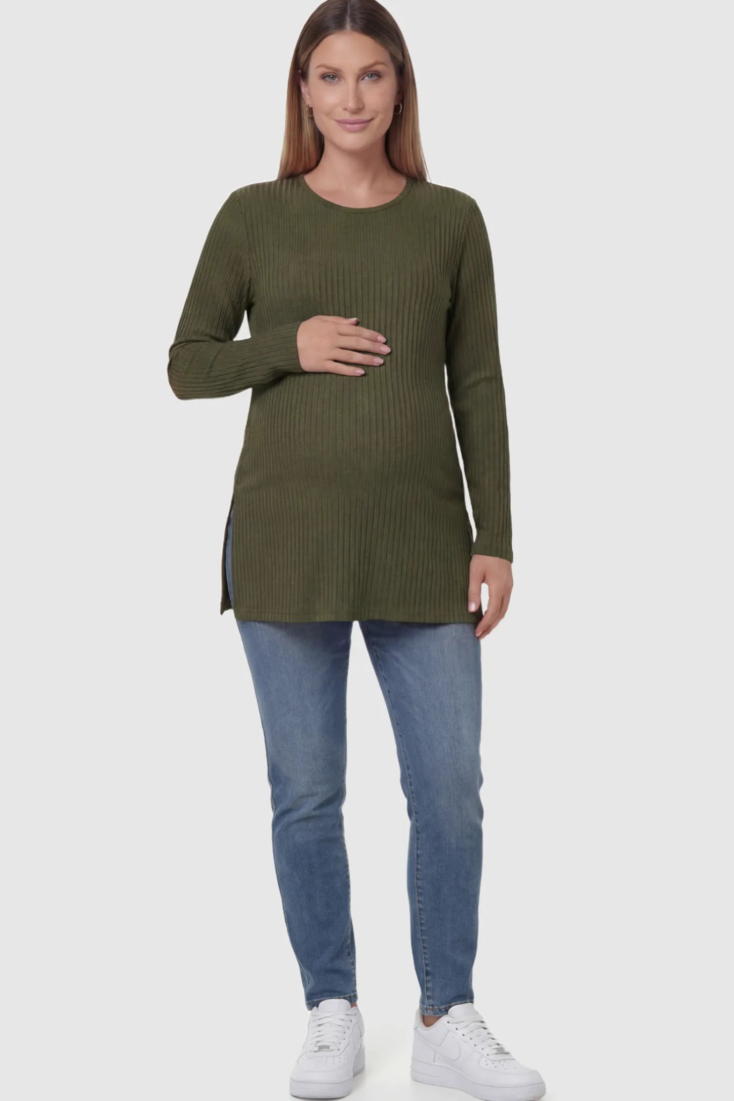 Ribbed Knit Long Sleeve Side Slit Maternity Top Ribbed Knit Side Slit Maternity Top in Green featuring high-stretch fabric and tunic length on a pregnant model showing front.