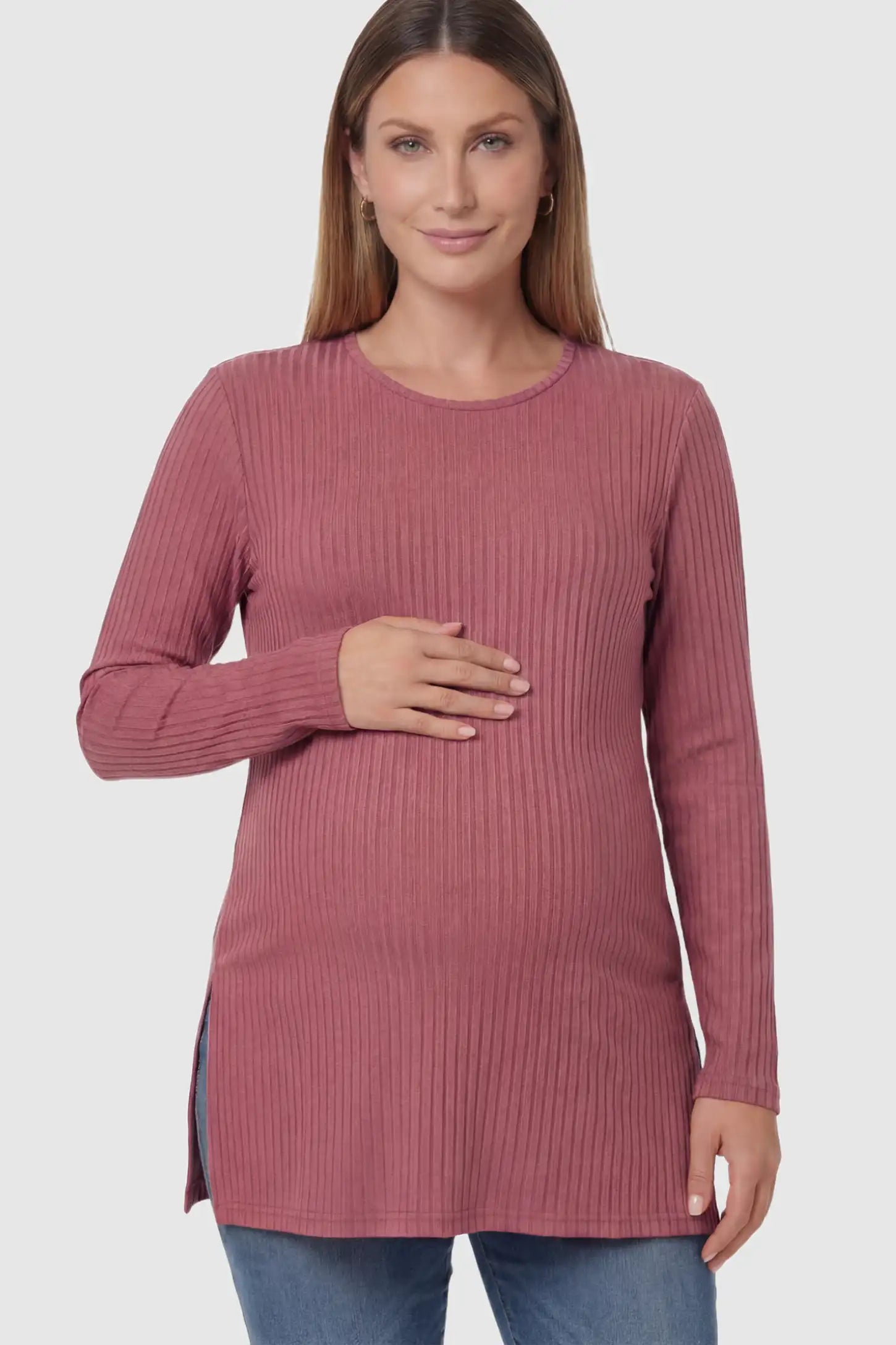 Ribbed Knit Long Sleeve Side Slit Maternity Top Ribbed Knit Side Slit Maternity Top in Pink featuring high-stretch fabric and tunic length on a pregnant model posing front.