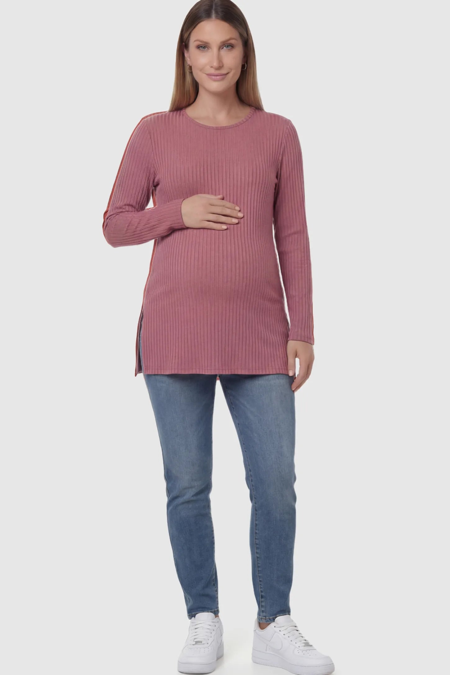 Ribbed Knit Long Sleeve Side Slit Maternity Top Ribbed Knit Side Slit Maternity Top in Pink featuring high-stretch fabric and tunic length on a pregnant model showing front.