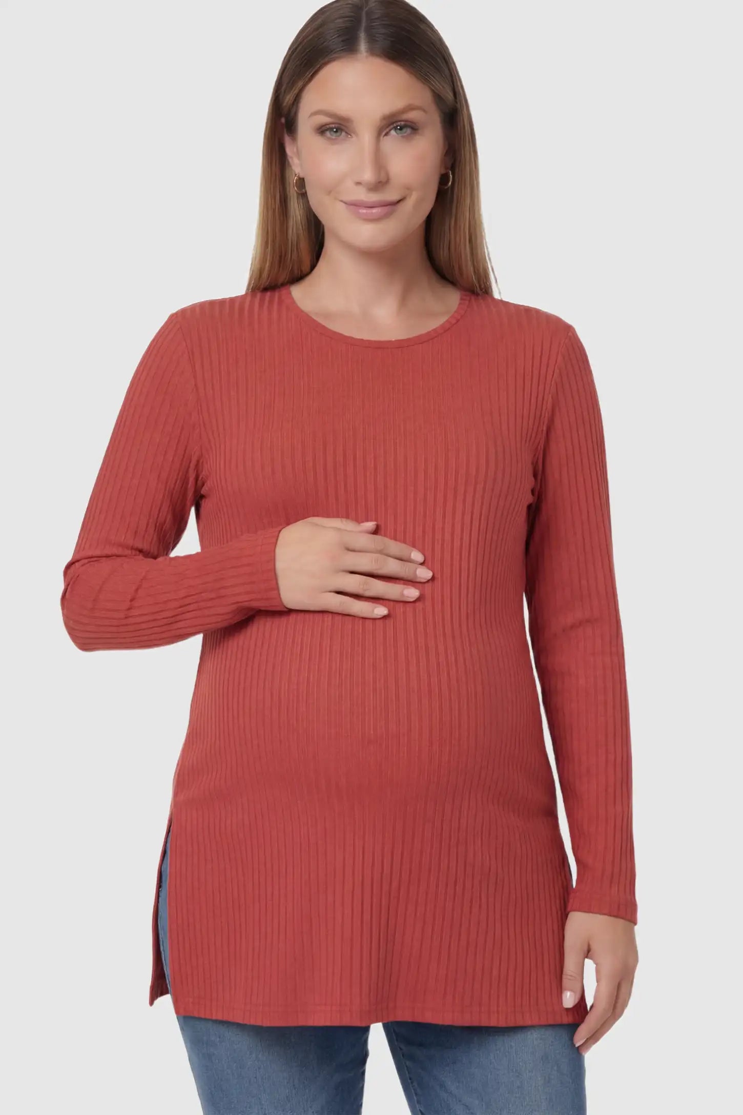 Ribbed Knit Long Sleeve Side Slit Maternity Top Ribbed Knit Side Slit Maternity Top in Red featuring high-stretch fabric and tunic length on a pregnant model posing front.