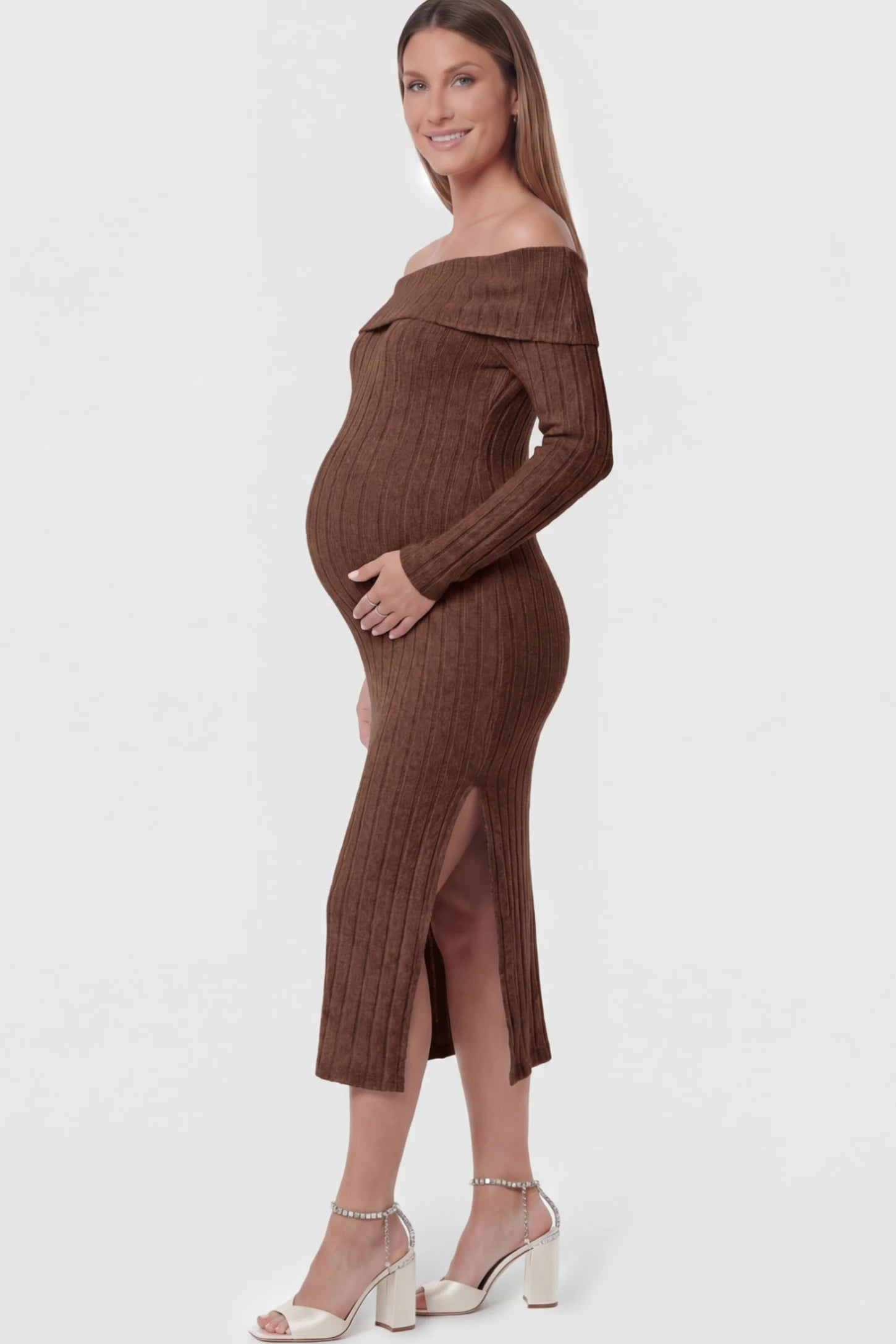 Ribbed Knit Off Shoulder Side Slit Maternity Midi Dress Ribbed Knit Side Slit Off Shoulder Maternity Midi Dress in Brown featuring a fold-over neckline on a pregnant model showing side.