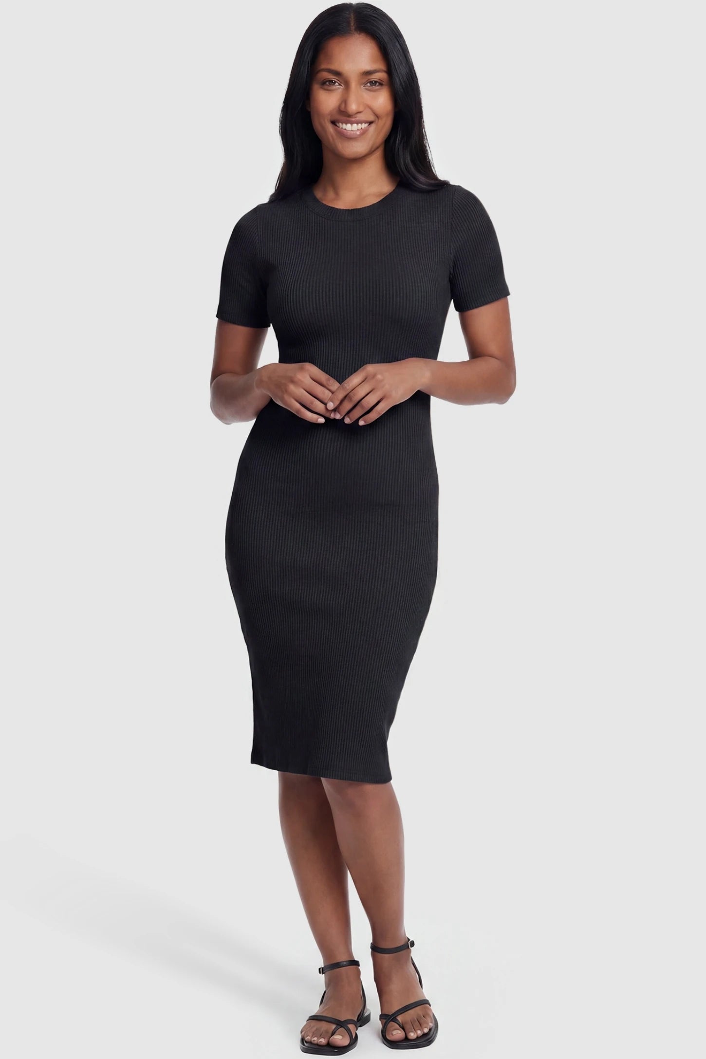 Ribbed Knit Short Sleeve Midi Maternity Dress Ribbed Knit Short Sleeve Midi Maternity Dress in Black featuring a flattering body-contouring ribbed knit on a non-pregnant model, front view.