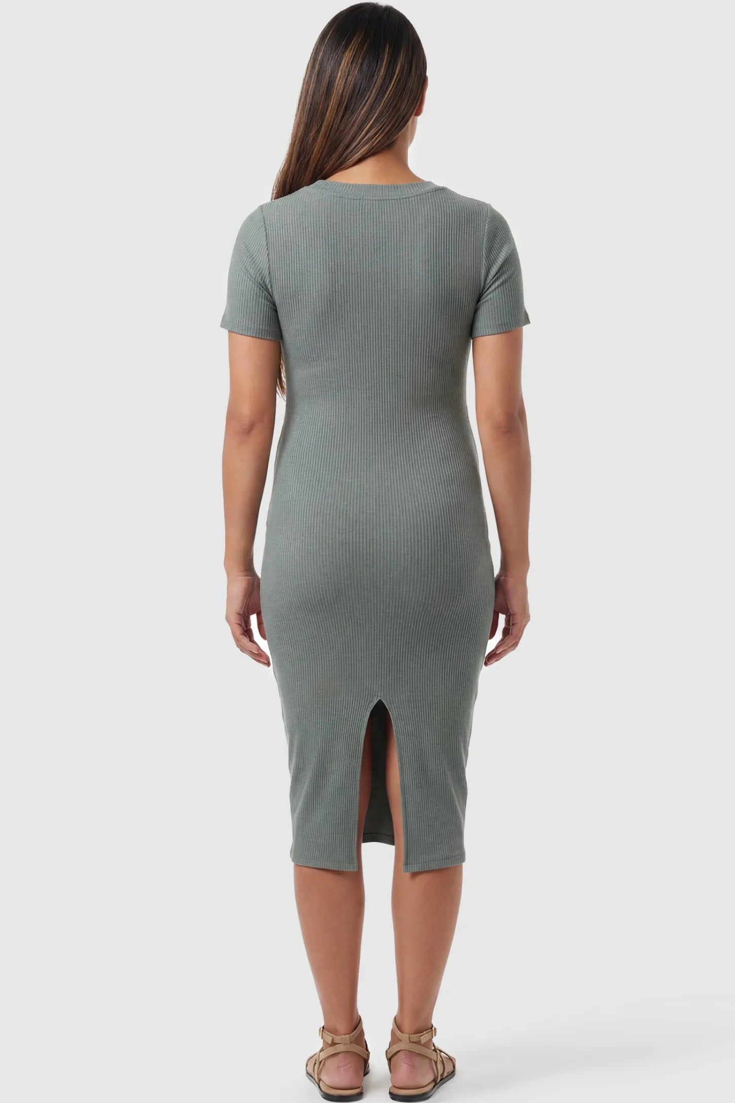 Ribbed Knit Short Sleeve Midi Maternity Dress Ribbed Knit Short Sleeve Midi Maternity Dress in Green featuring a center back slit for easy movement on a pregnant model, back view.