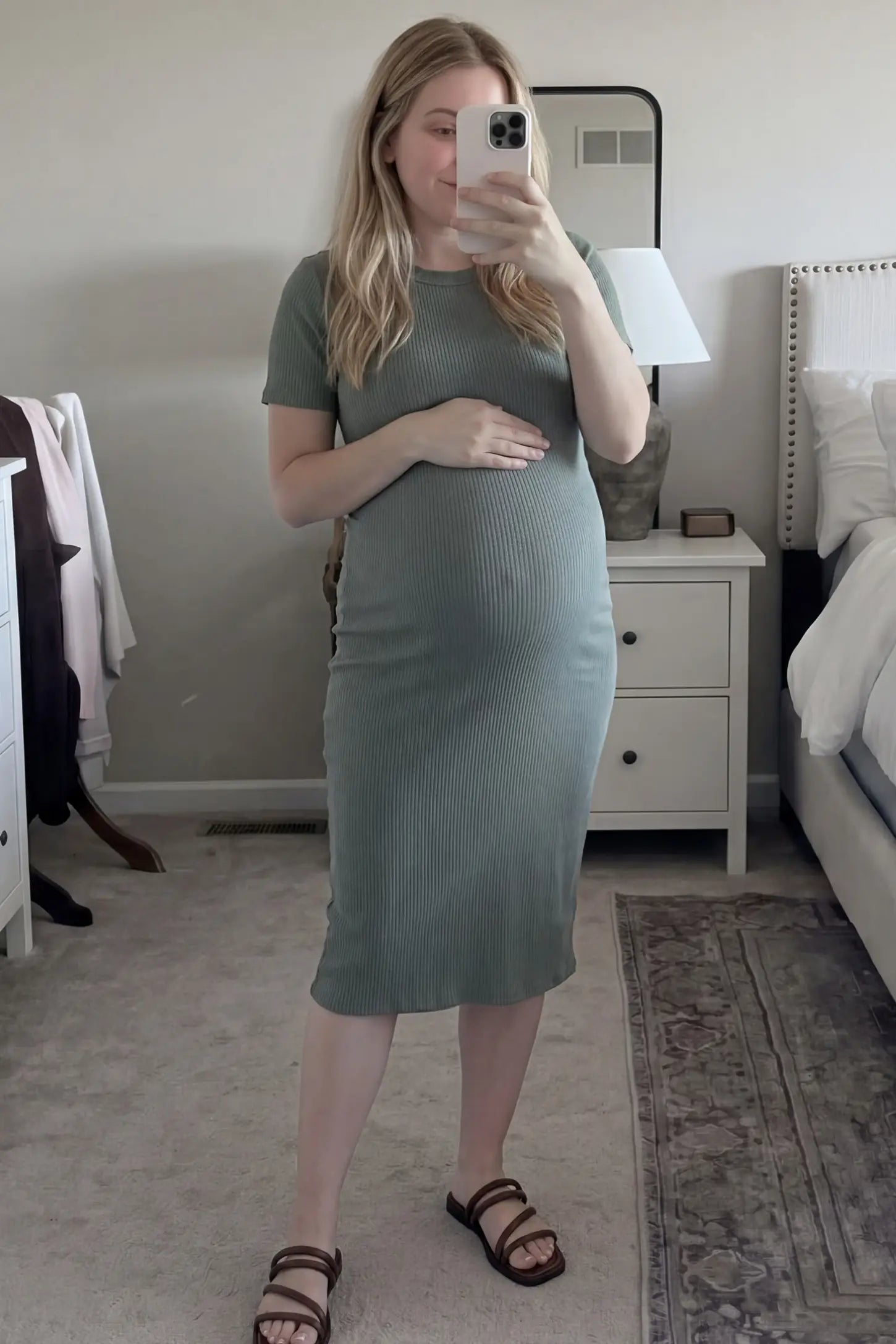 Ribbed Knit Short Sleeve Midi Maternity Dress Ribbed Knit Short Sleeve Midi Maternity Dress in Green featuring a stretchy ribbed fabric that hugs the bump, worn by a real customer, mirror selfie view