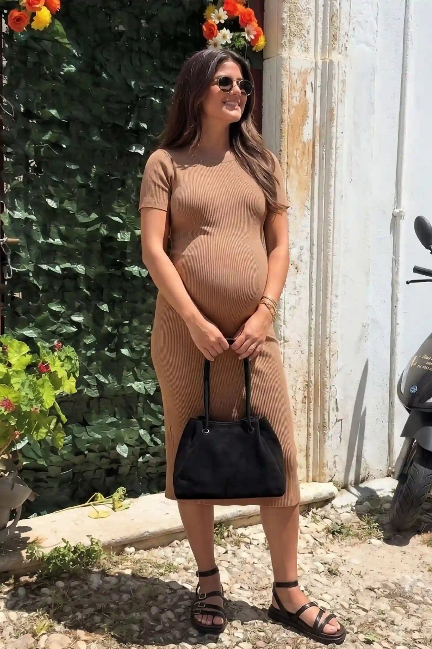 Ribbed Knit Short Sleeve Midi Maternity Dress Ribbed Knit Short Sleeve Midi Maternity Dress in Khaki featuring a midi-length stretch fit on a pregnant model in an outdoor editorial setting.