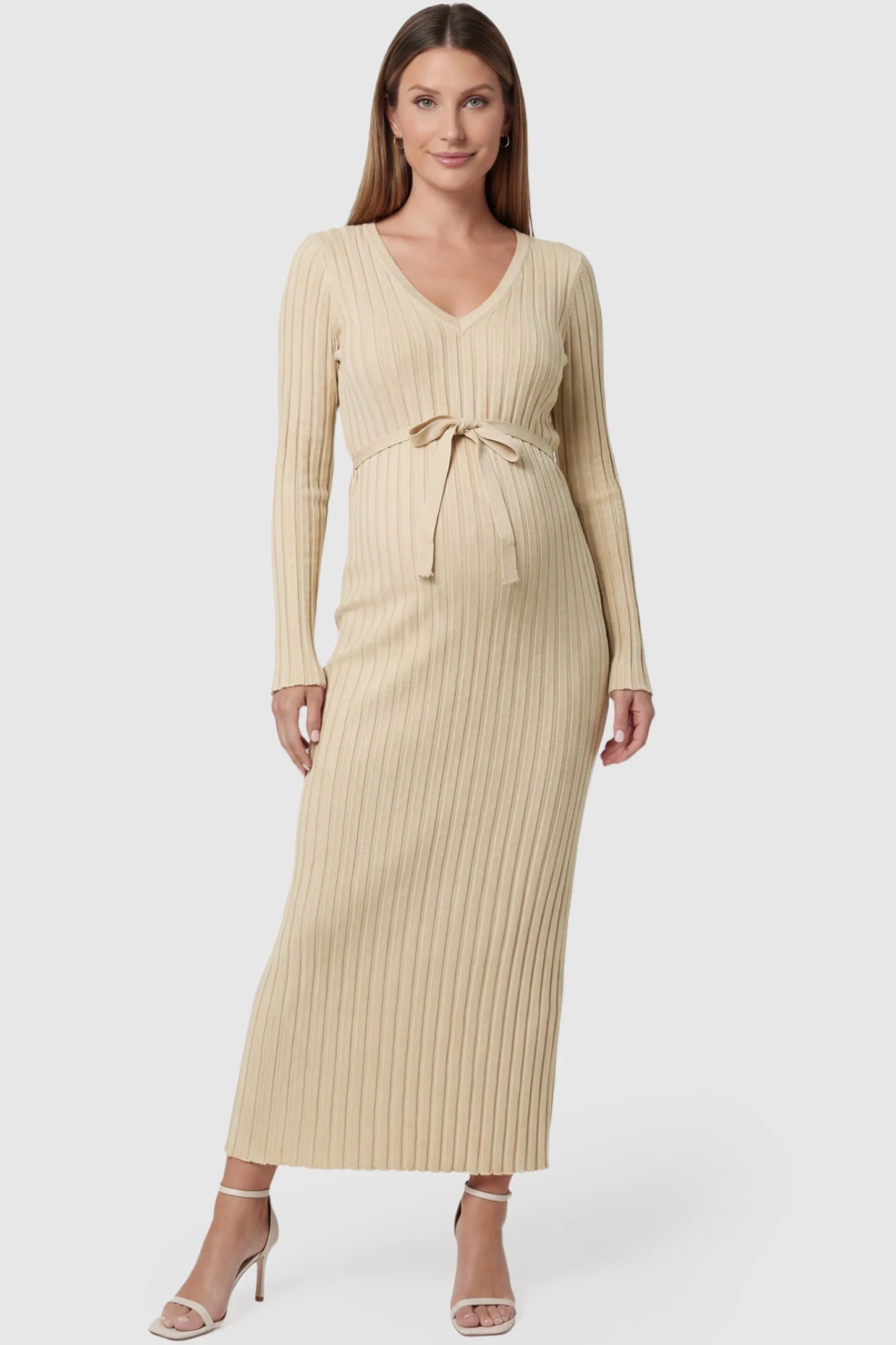 Ribbed Knit V-Neck Maternity Maxi Dress in Beige featuring a tie waist and long sleeves on a pregnant model, front view.
