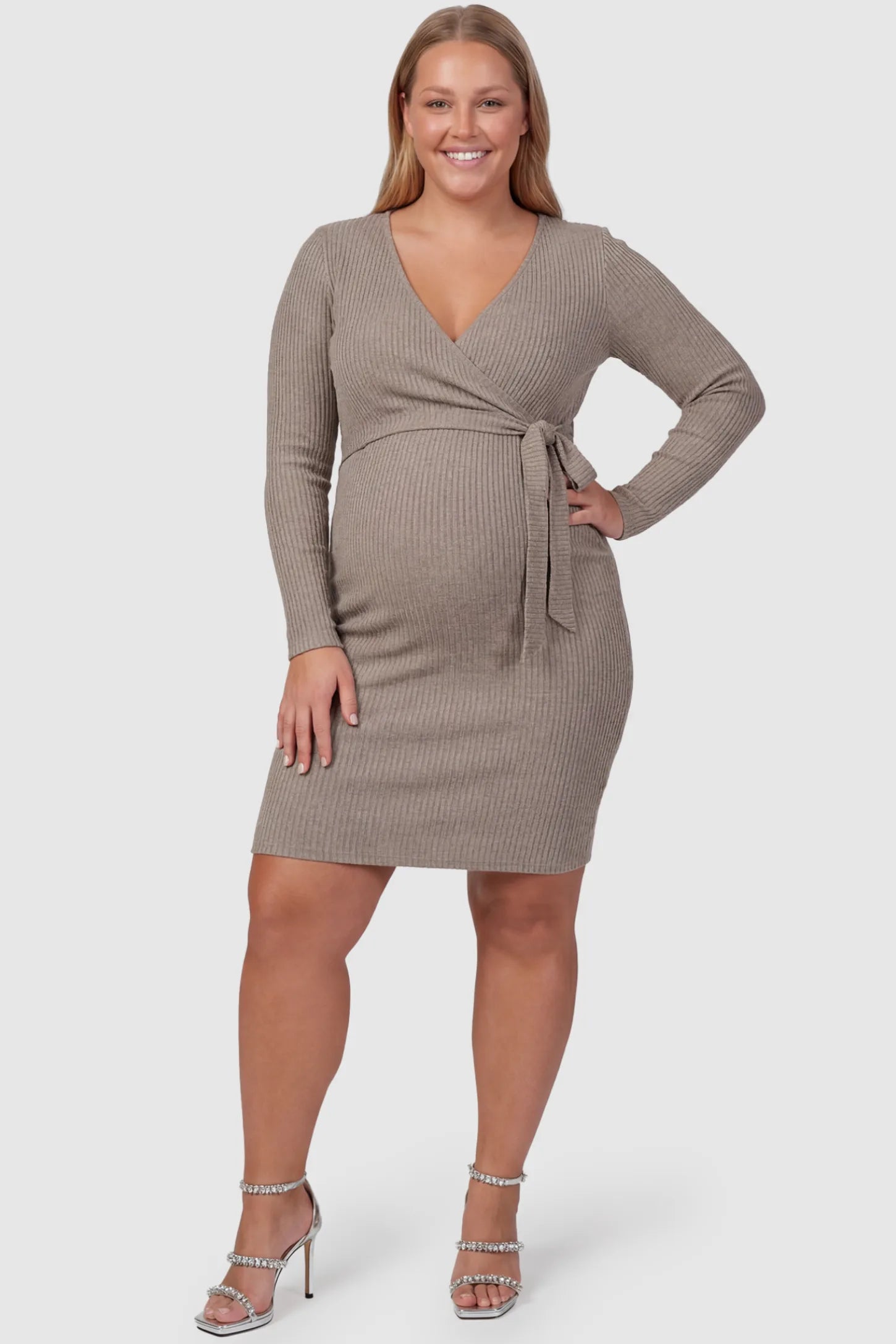 Ribbed Knit Wrap-Front Long Sleeve Maternity & Nursing Dress Ribbed Knit Wrap-Front Long Sleeve Maternity & Nursing Dress in Khaki featuring functional wrap bodice on a plus size pregnant model, front view.