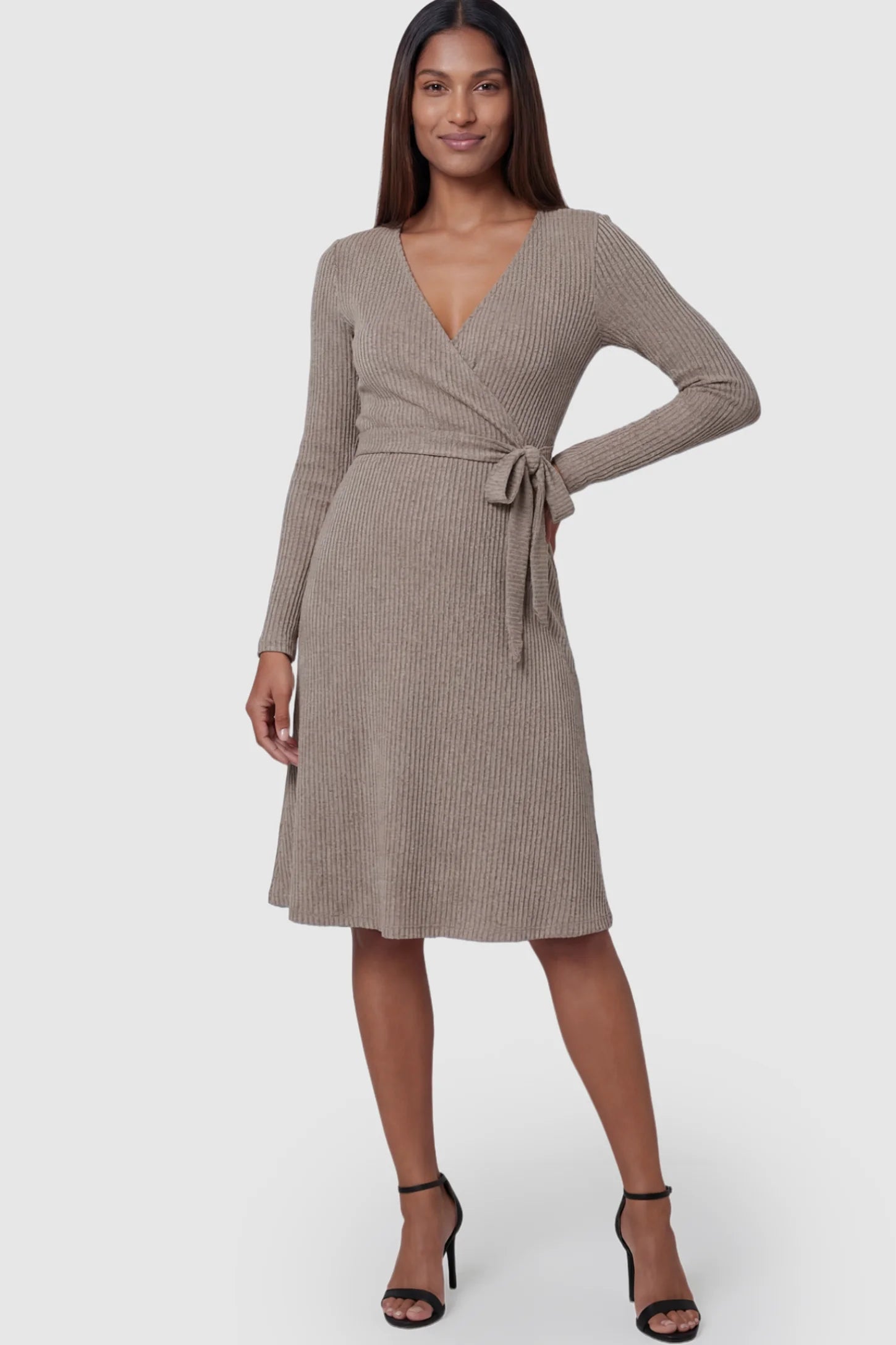 Ribbed Knit Wrap-Front Long Sleeve Maternity & Nursing Dress Ribbed Knit Wrap-Front Long Sleeve Maternity & Nursing Midi Dress in Khaki featuring a side-tie on a postpartum model.