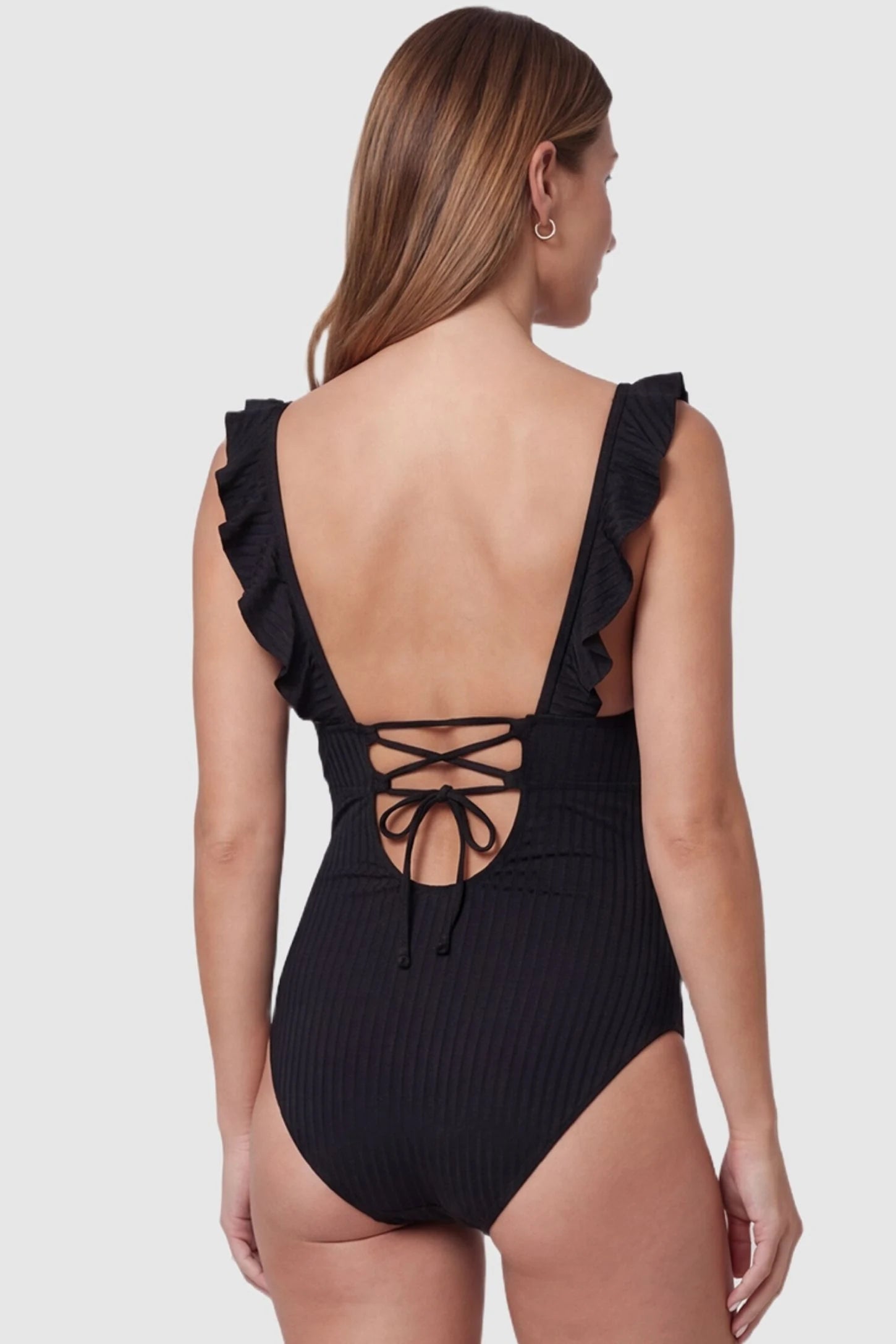 Ribbed Lace-Up Back Maternity One-Piece Ribbed Lace-Up Back Maternity One-Piece in Black featuring a functional lace-up back design on a pregnant model, back view.