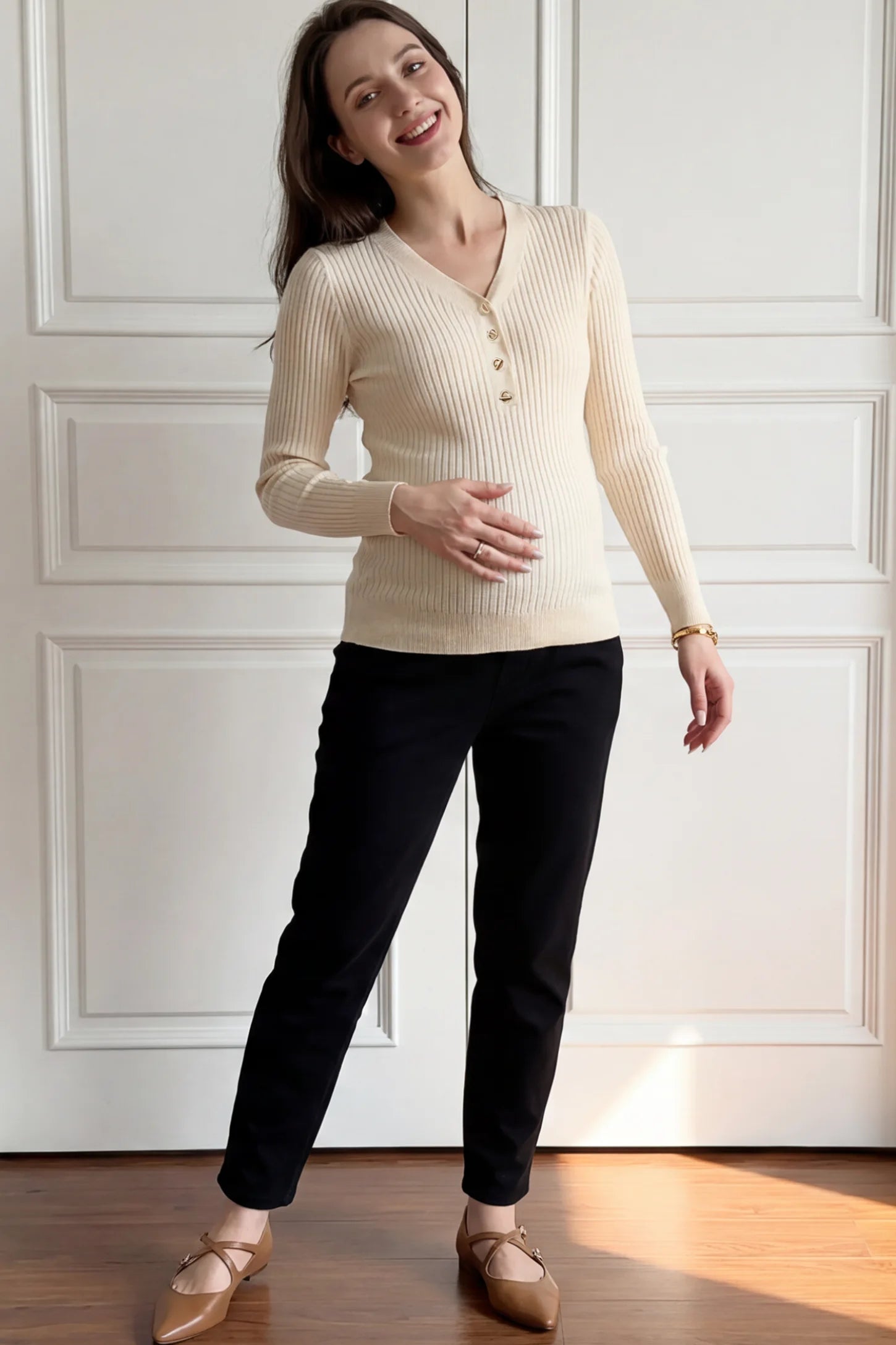 Ribbed Long Sleeve Maternity Henley Top Ribbed Maternity Henley Top in Apricot featuring a functional button placket and vertical rib knit on a pregnant woman.