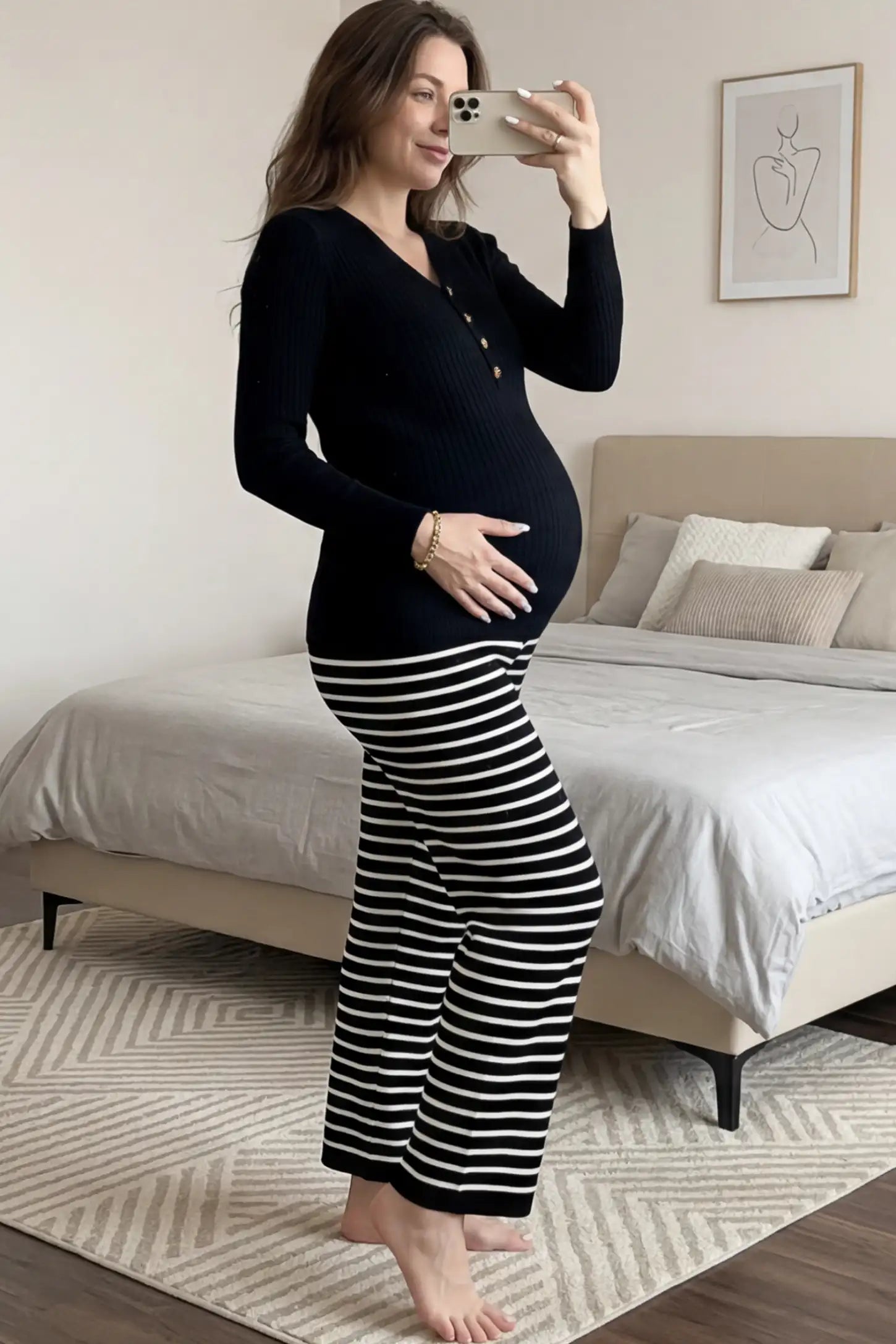 Ribbed Long Sleeve Maternity Henley Top Ribbed Maternity Henley Top in Black featuring a functional button placket and vertical rib knit on a pregnant woman.