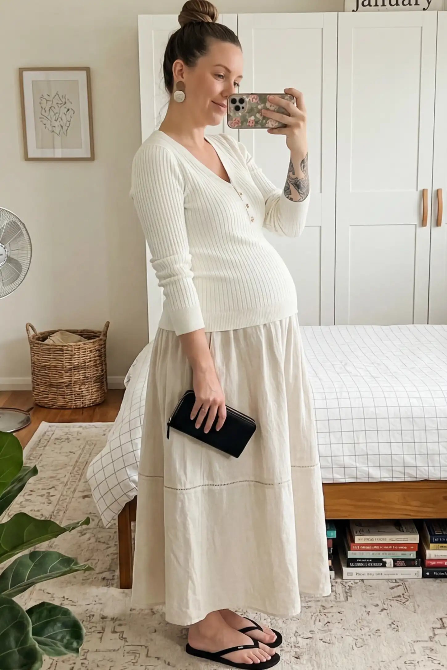 Ribbed Long Sleeve Maternity Henley Top Ribbed Maternity Henley Top in Off White featuring a functional button placket and vertical rib knit on a pregnant woman.