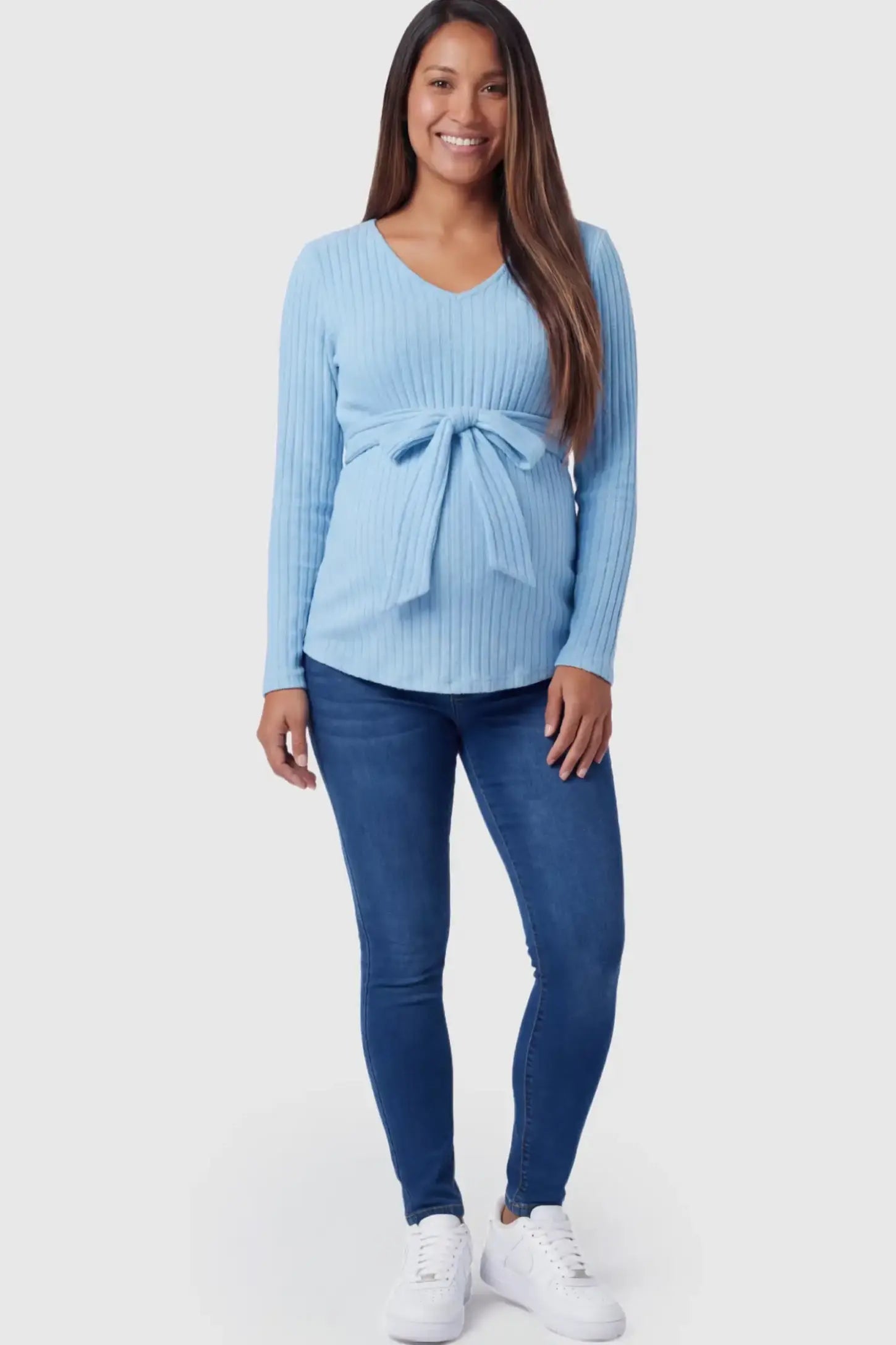 Ribbed Front Tie-Waist Long Sleeve Maternity Top Ribbed Front Tie-Waist Long Sleeve Maternity Top in blue featuring a stretch knit fabric on a pregnant model.