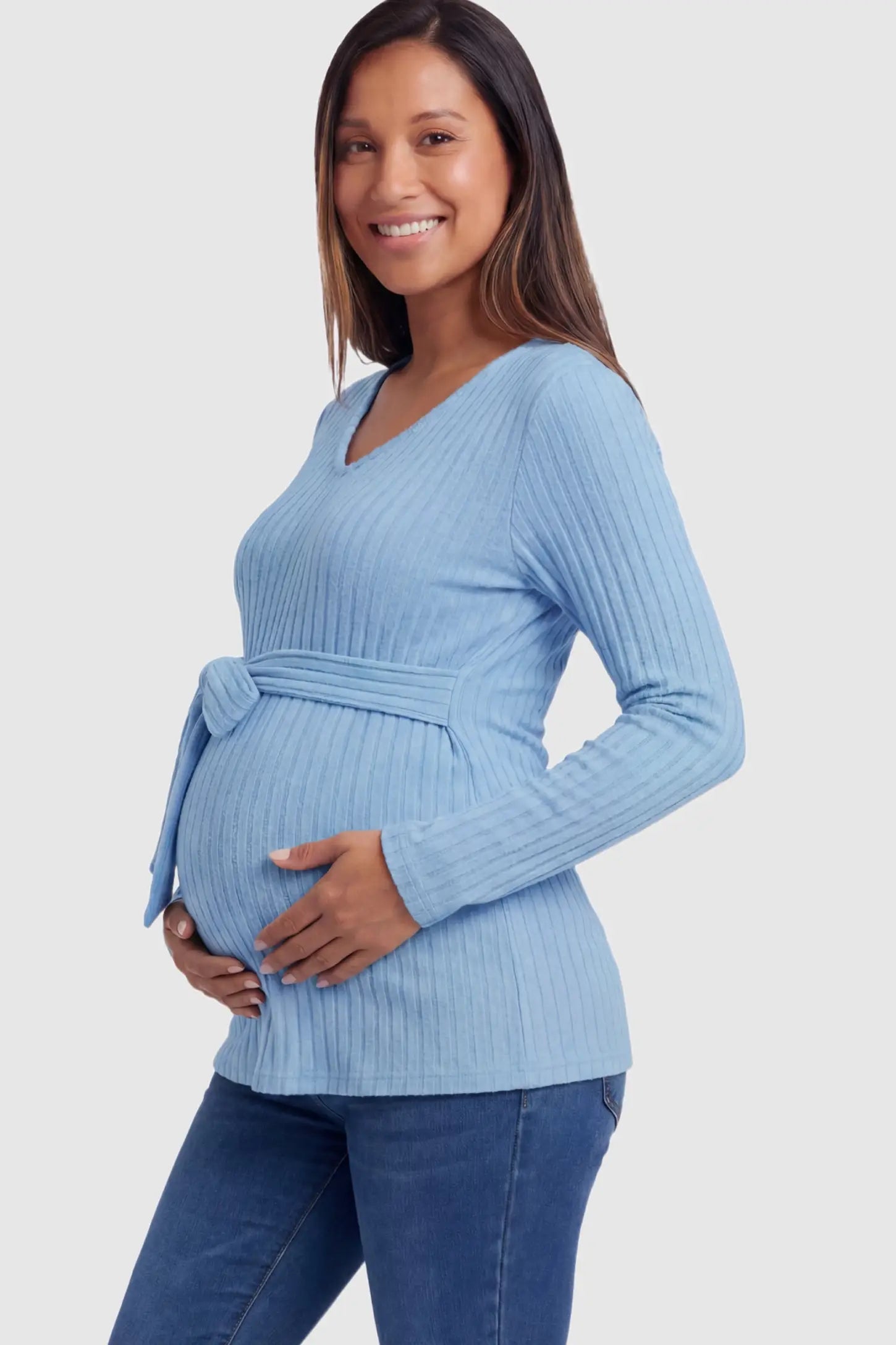 Ribbed Front Tie-Waist Long Sleeve Maternity Top in blue featuring a stretch knit fabric on a pregnant model.
