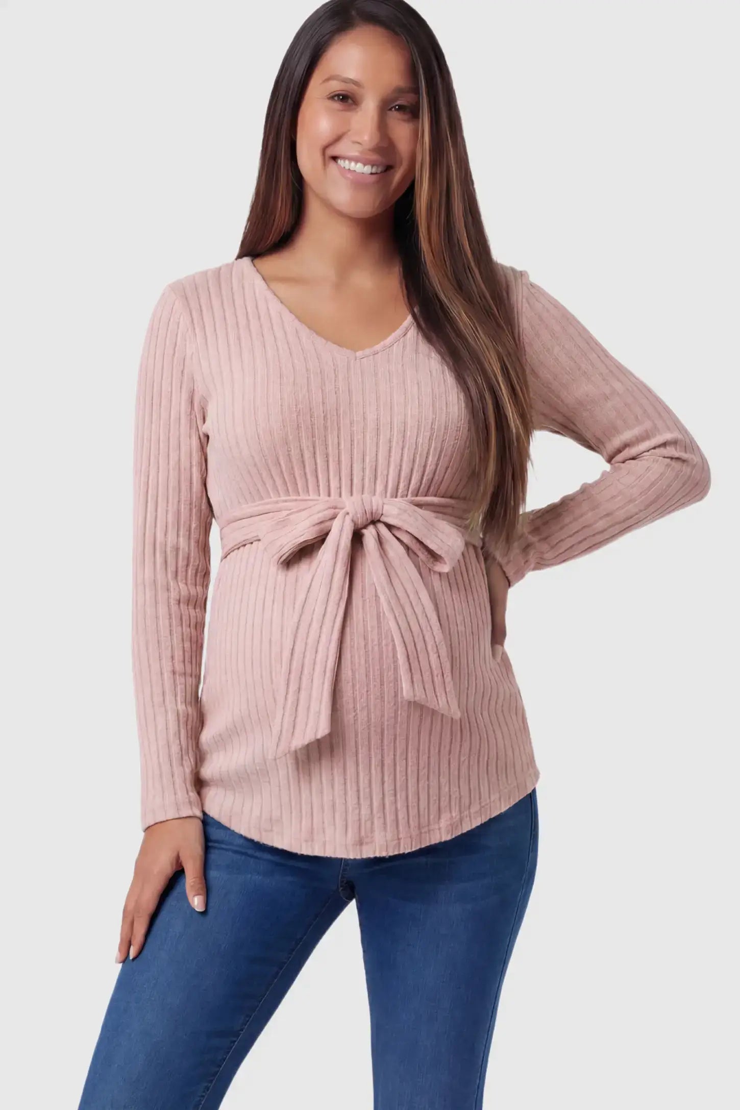 Ribbed Front Tie-Waist Long Sleeve Maternity Top Ribbed Front Tie-Waist Long Sleeve Maternity Top in pink featuring a stretch knit fabric on a pregnant model.
