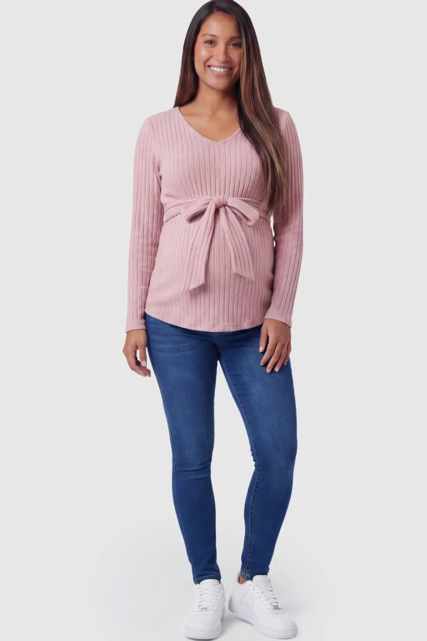 Ribbed Front Tie-Waist Long Sleeve Maternity Top Ribbed Front Tie-Waist Long Sleeve Maternity Top in pink featuring a stretch knit fabric on a pregnant model.