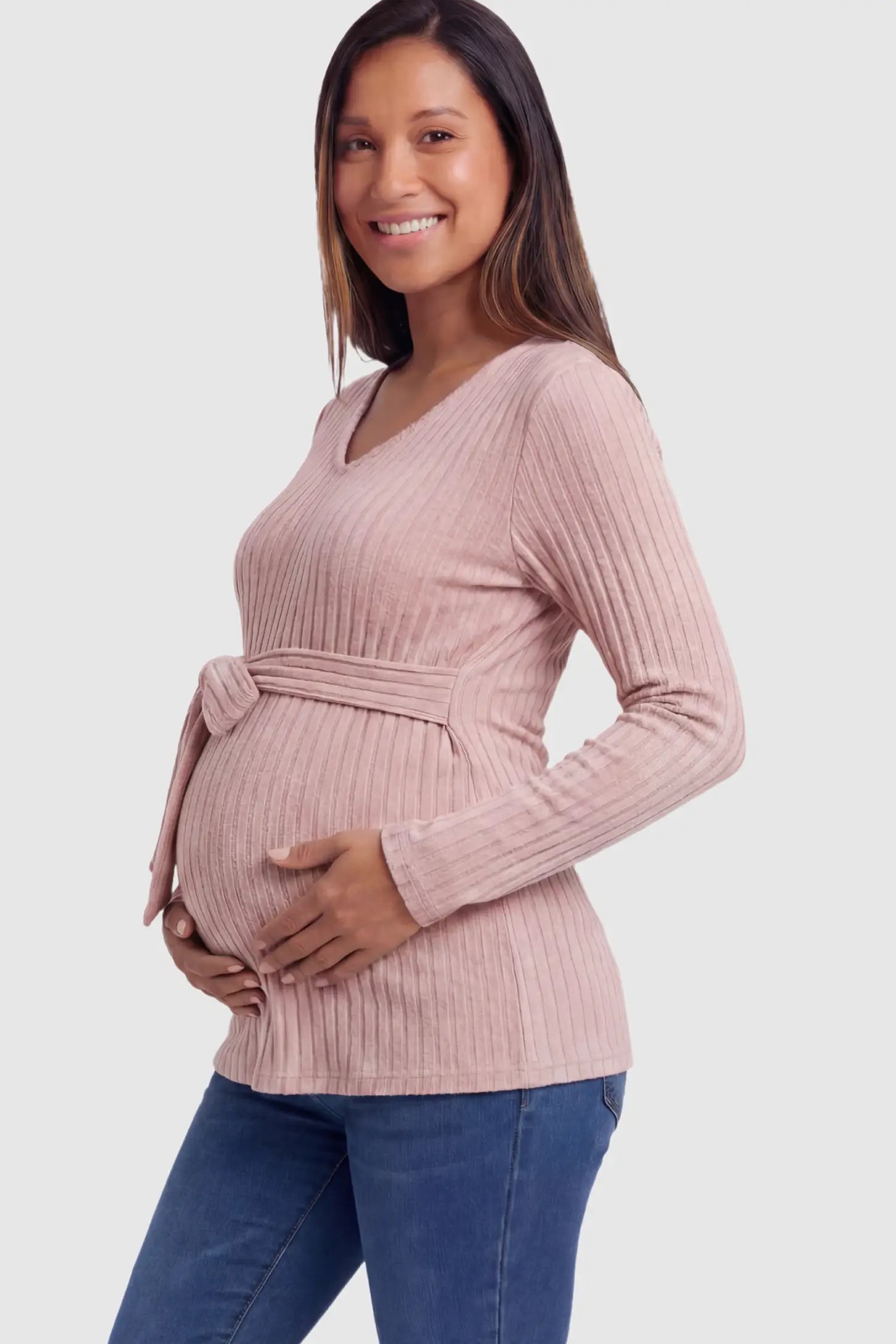 Ribbed Front Tie-Waist Long Sleeve Maternity Top Ribbed Front Tie-Waist Long Sleeve Maternity Top in pink featuring a stretch knit fabric on a pregnant model.