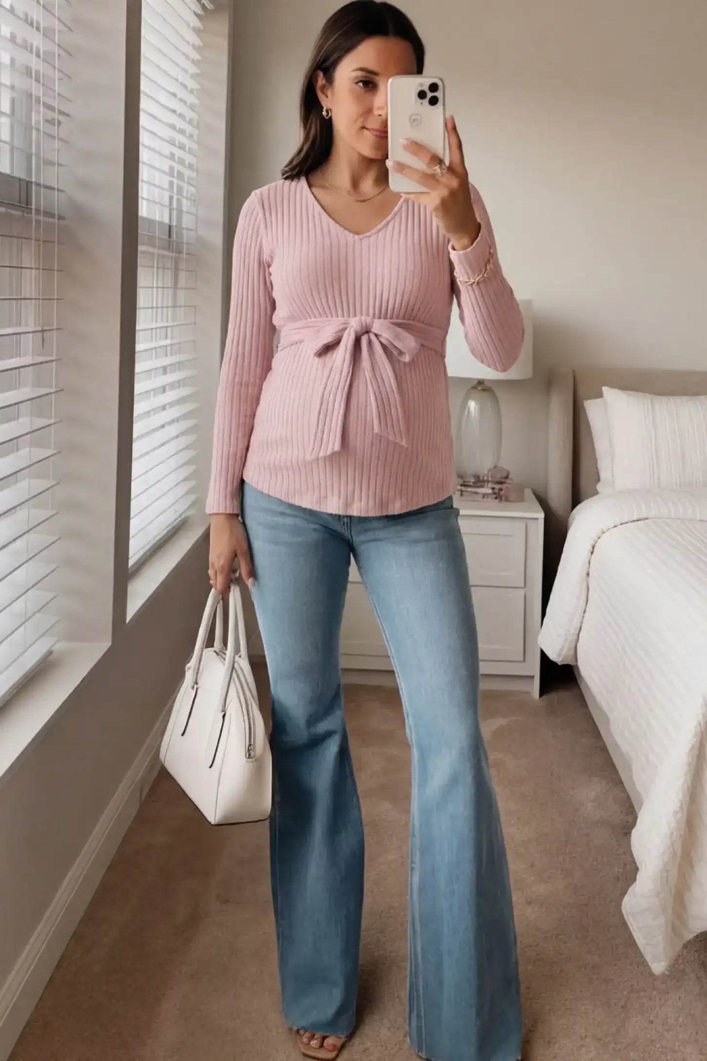Ribbed Front Tie-Waist Long Sleeve Maternity Top Ribbed Front Tie-Waist Long Sleeve Maternity Top in pink featuring a stretch knit fabric on a pregnant model.
