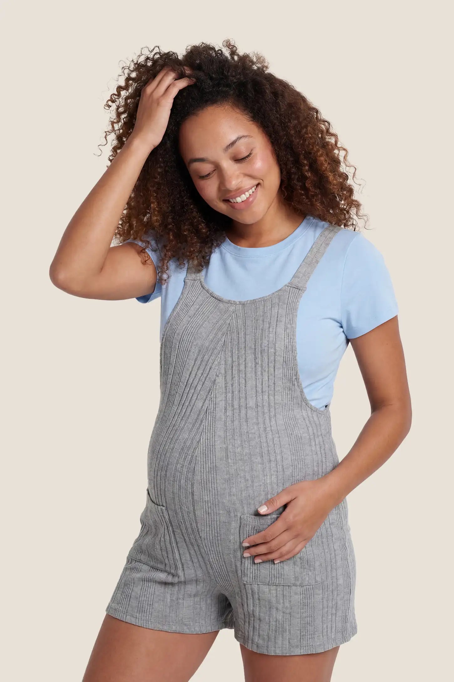 Ribbed Pocket Knit Maternity Romper Front view of the gray Ribbed Pocket Knit Maternity Romper with a soft ribbed knit texture and front pockets.