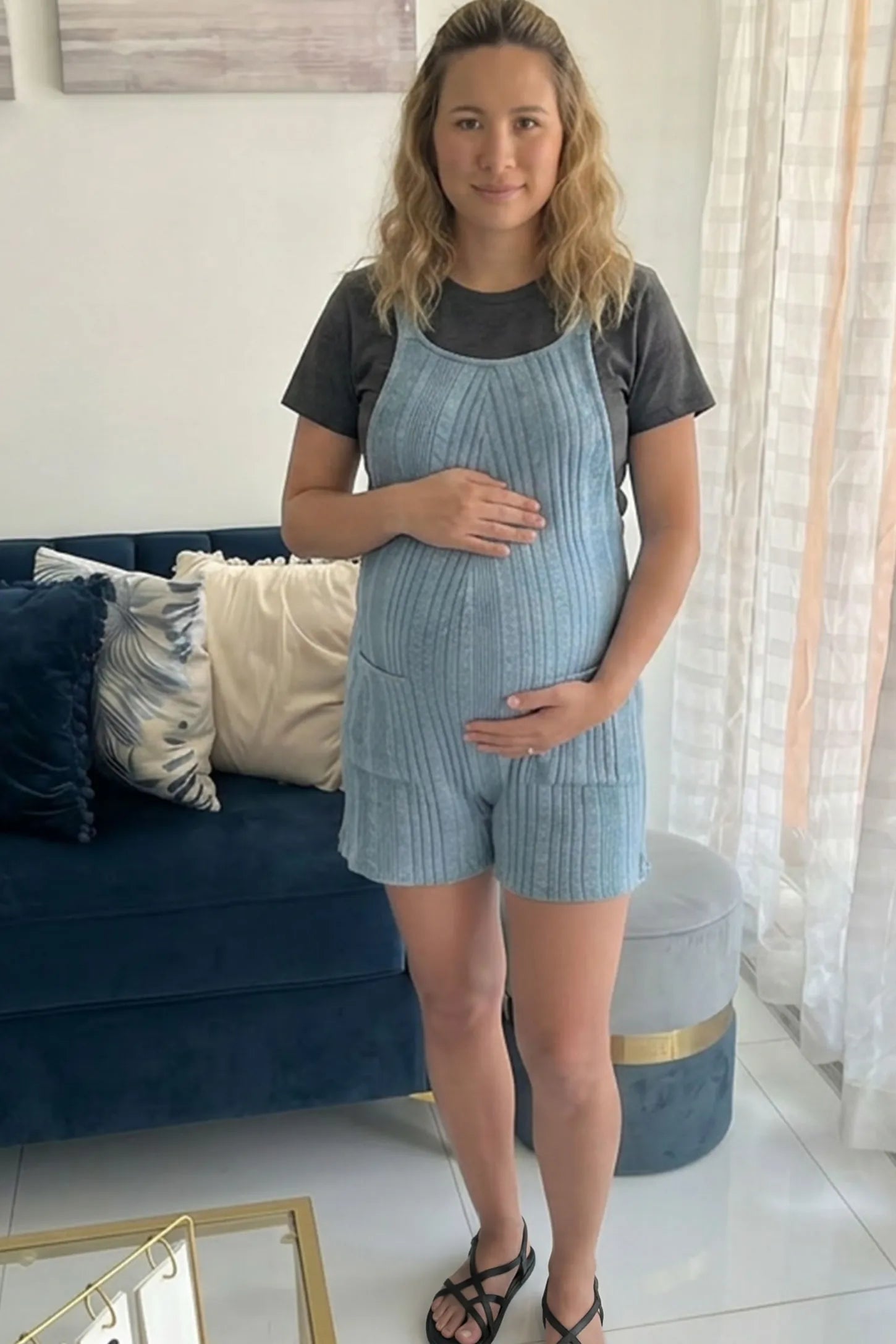 Ribbed Pocket Knit Maternity Romper Ribbed Pocket Knit Romper in Blue featuring a soft ribbed finish on a pregnant model, UGC view.