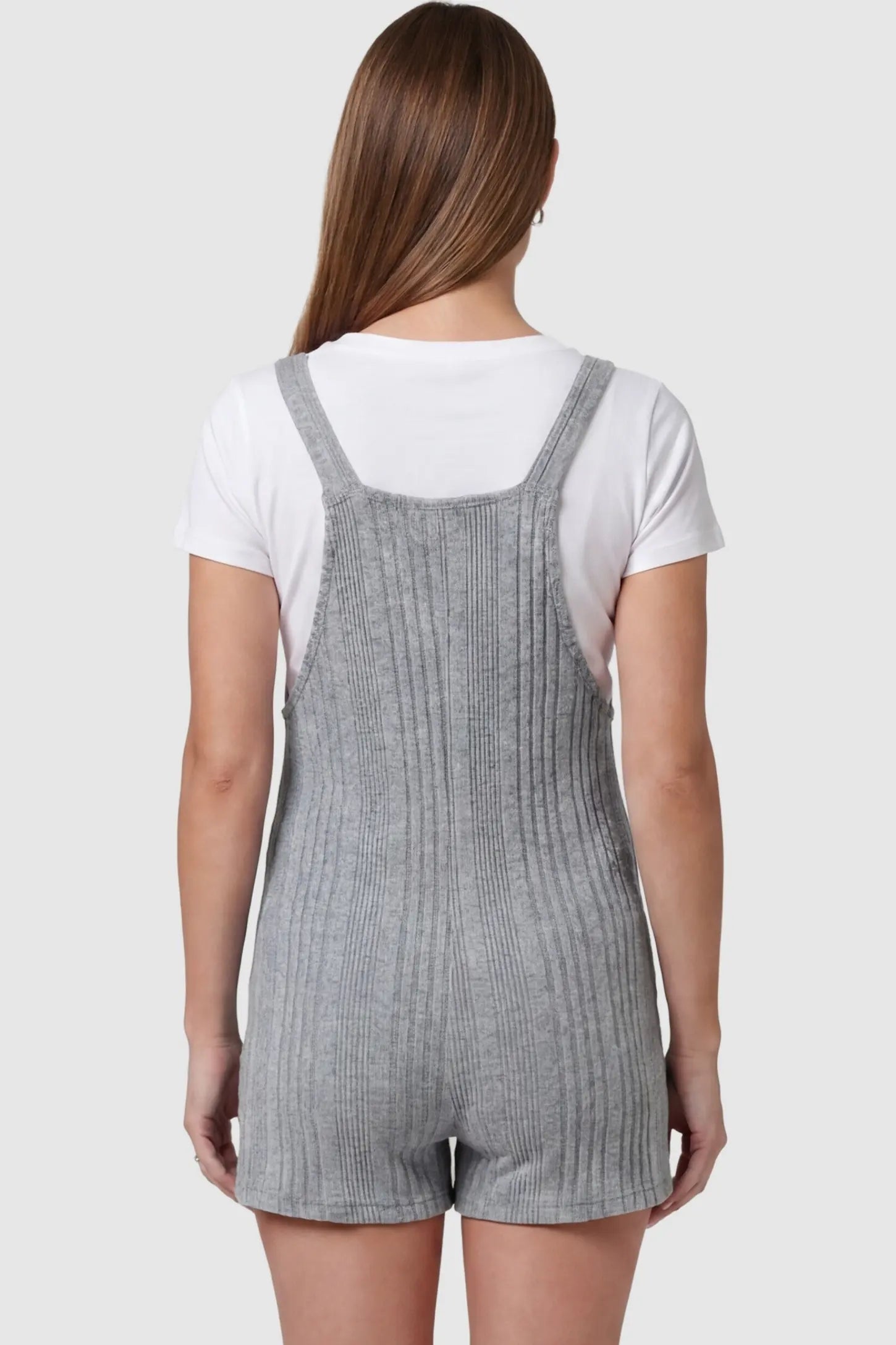 Ribbed Pocket Knit Maternity Romper Ribbed Pocket Knit Romper in Gray featuring an all-over ribbed pattern on a pregnant model, back view.