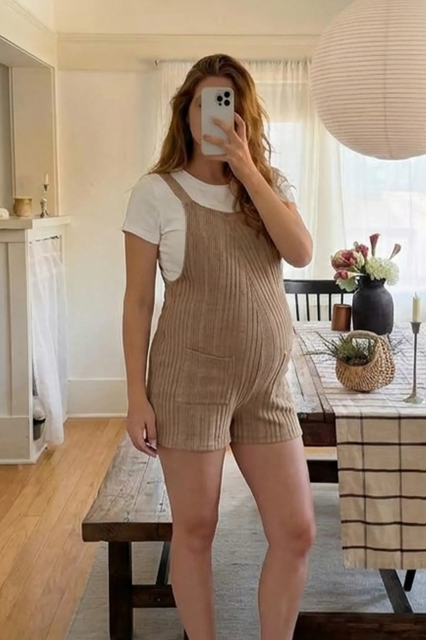 Ribbed Pocket Knit Maternity Romper  Ribbed Pocket Knit Romper in Khaki featuring a soft ribbed finish on a pregnant model, mirror selfie view.