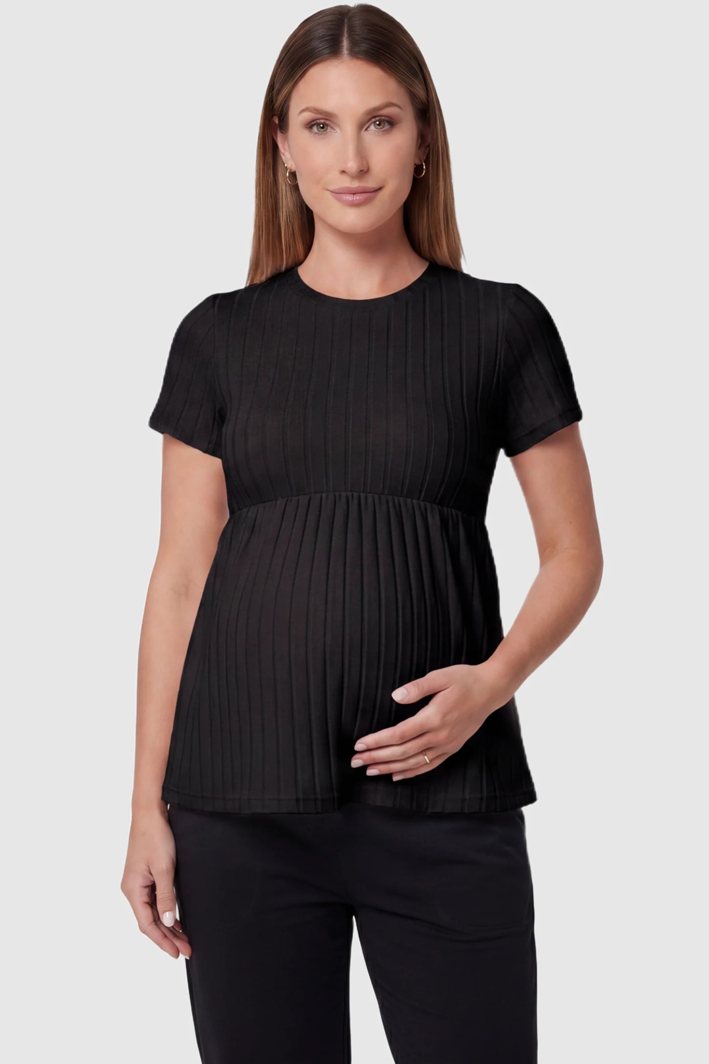 Ribbed Round Neck Short Sleeve Maternity Top in Black featuring a soft knit stretch and short sleeves on a pregnant model, front view.