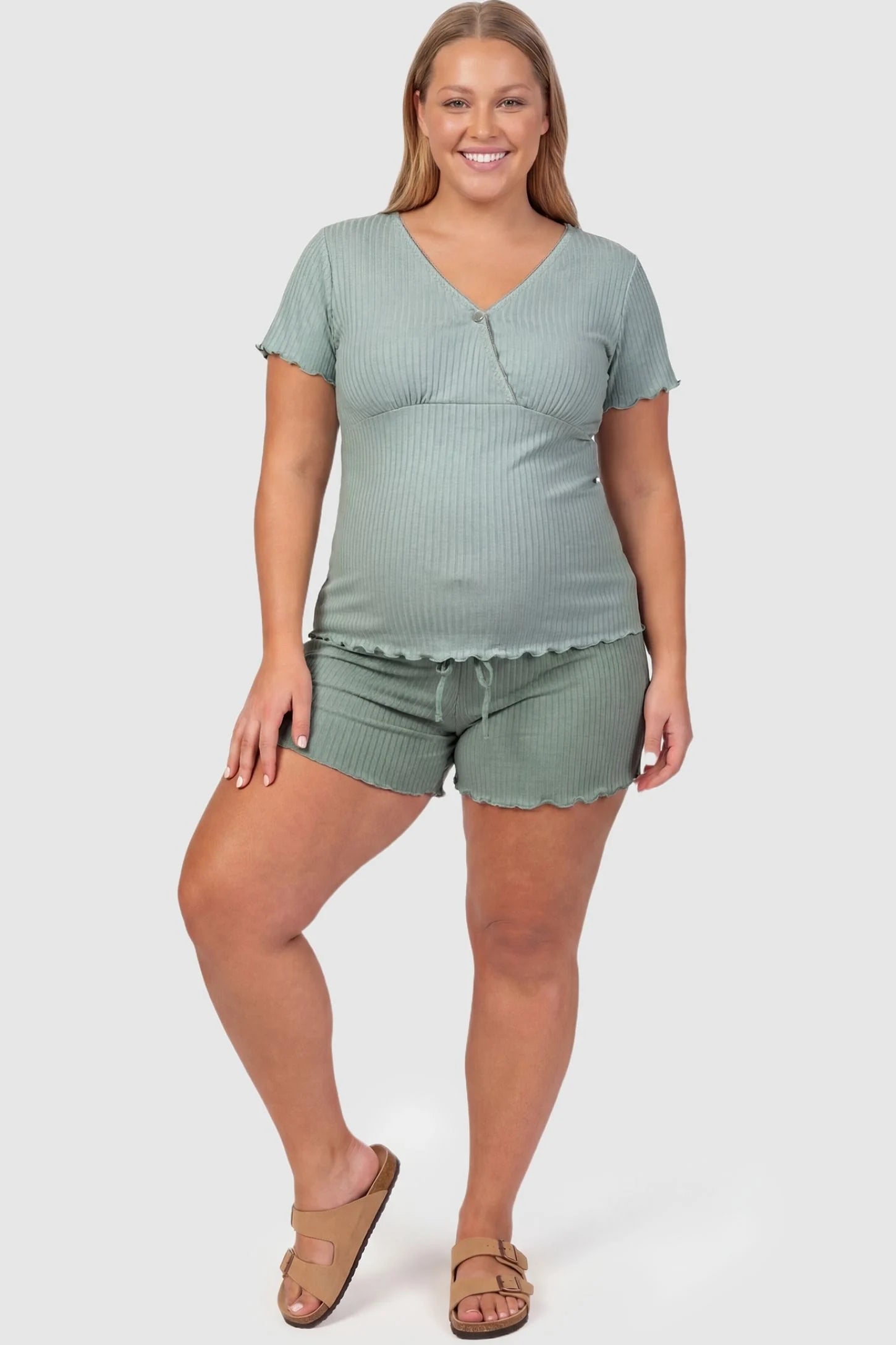 Ribbed Short Sleeve & Drawstring Shorts Maternity Pajama Set Ribbed Short Sleeve & Drawstring Shorts Maternity Pajama Set in Green featuring soft ribbed recovery fabric on a plus-size pregnant model, front view.