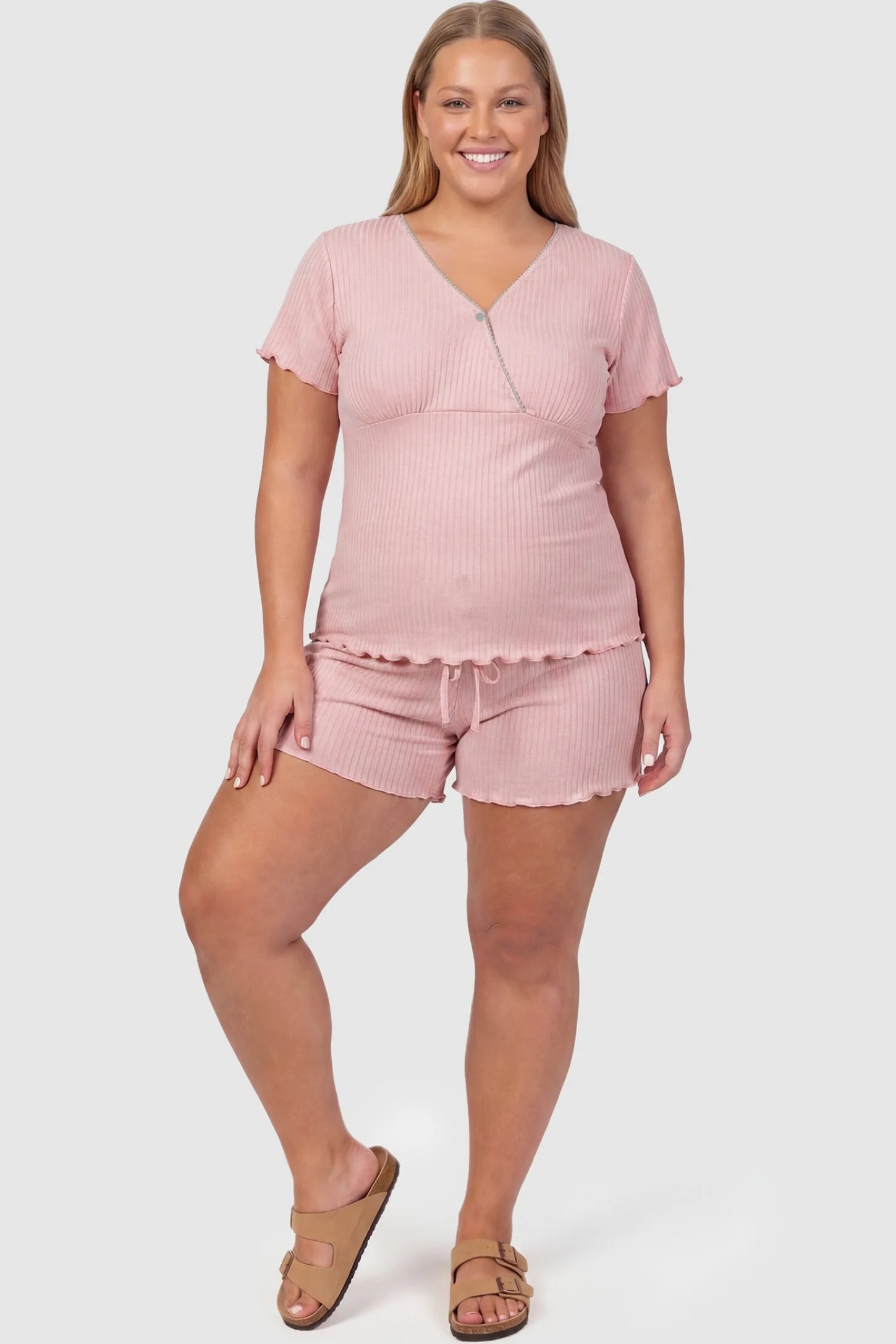 Ribbed Short Sleeve & Drawstring Shorts Maternity Pajama Set Ribbed Short Sleeve & Drawstring Shorts Maternity Pajama Set in Pink featuring soft fine-rib knit on a pregnant plus-size model, front view.