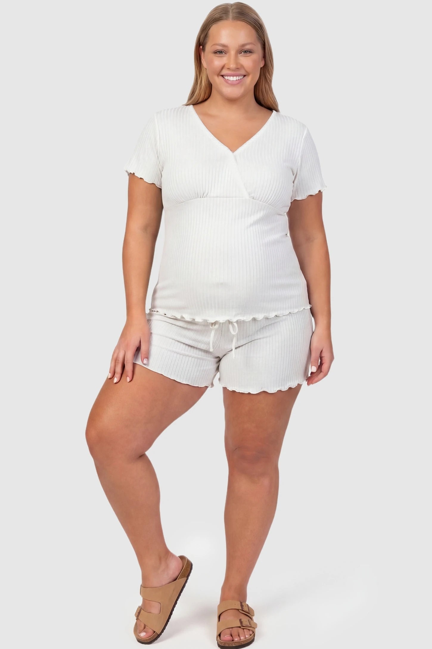 Ribbed Short Sleeve & Drawstring Shorts Maternity Pajama Set Ribbed Short Sleeve & Drawstring Shorts Maternity Pajama Set in White featuring soft fine-rib knit on a pregnant plus-size model, front view.