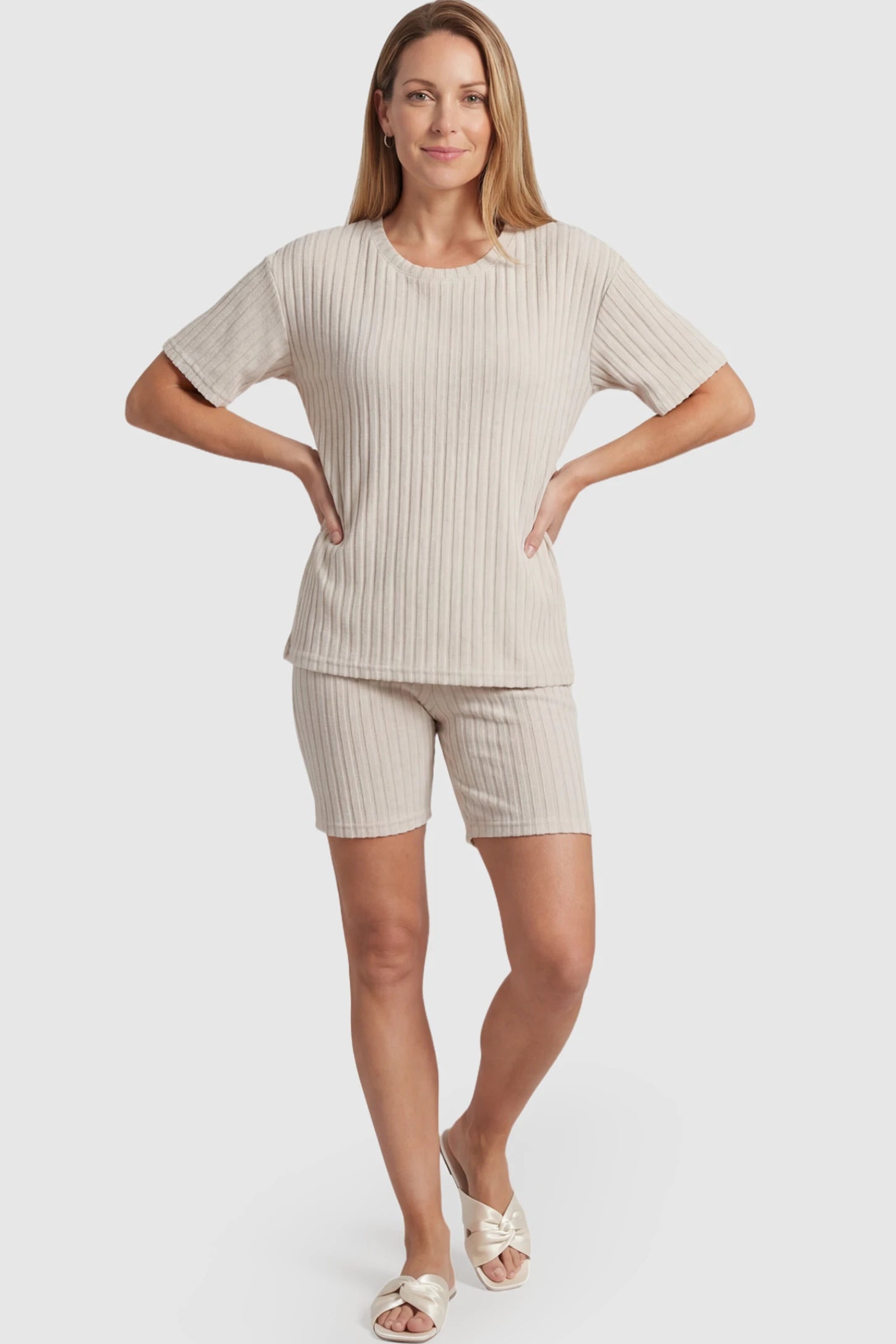 Ribbed Short Sleeve Top Biker Shorts Maternity Lounge Set Ribbed Vertical Stripe Maternity Loungewear Set in White With pinstripes featuring a high-rise waistband on a postpartum model showing front.