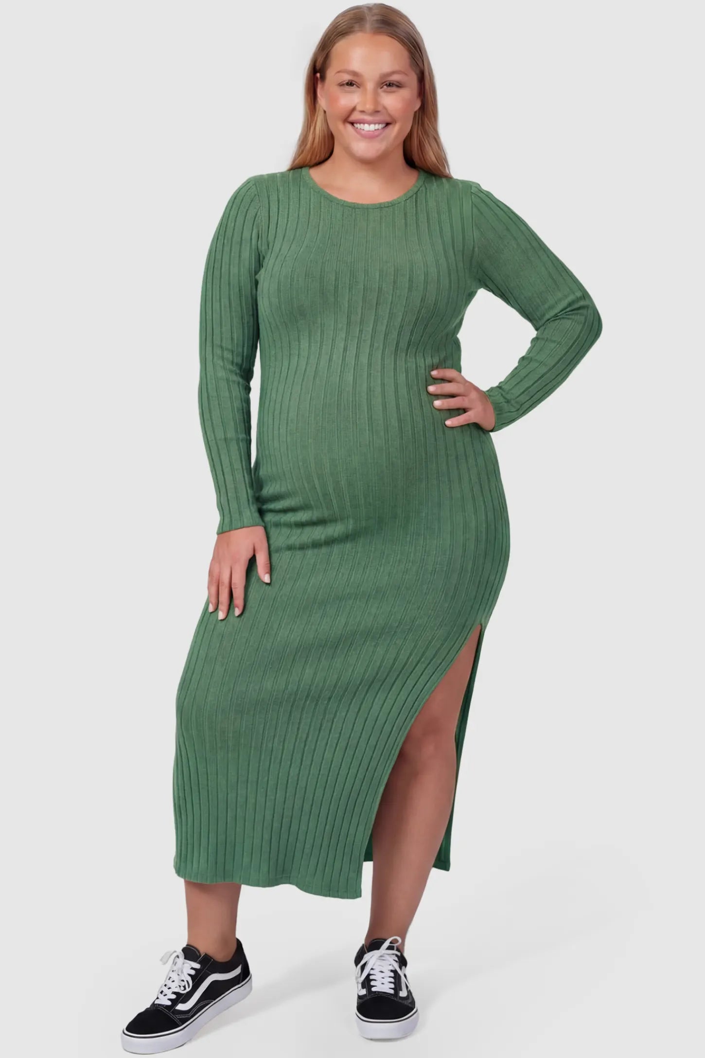 Ribbed Side Slit Fitted Long Sleeve Maternity Maxi Dress Ribbed Side Slit Fitted Long Sleeve Maternity Maxi Dress in Green featuring a high side slit on a plus size pregnant model, front view.