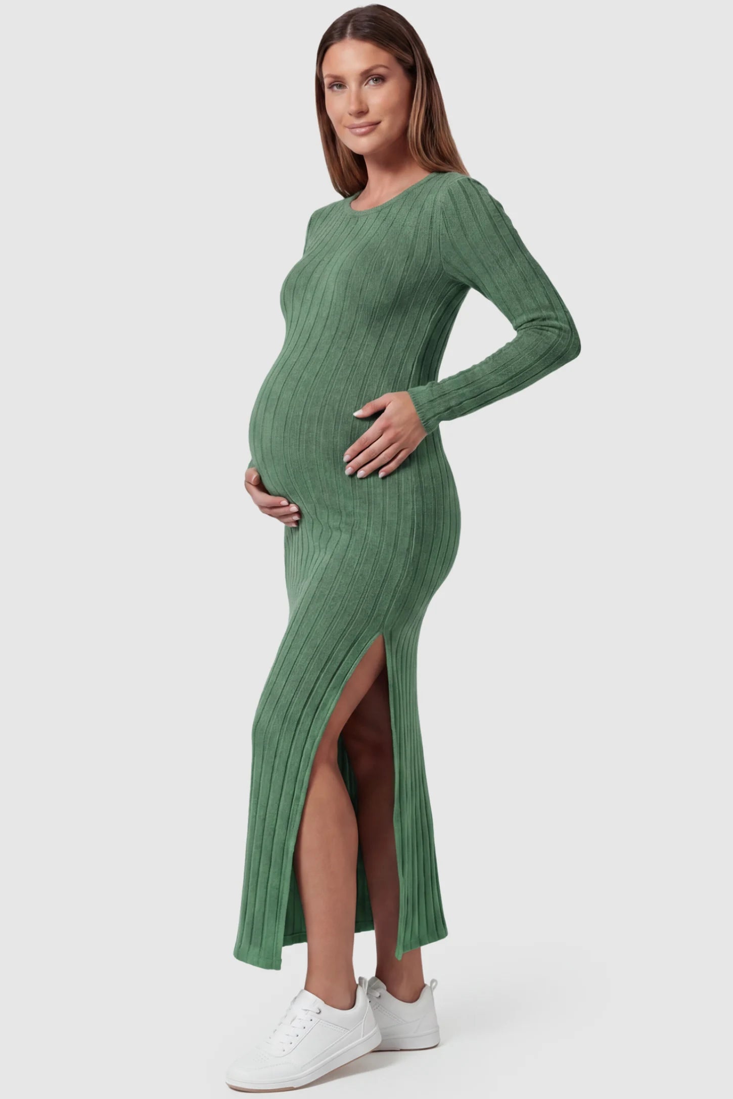 Ribbed Side Slit Fitted Long Sleeve Maternity Maxi Dress Ribbed Side Slit Fitted Long Sleeve Maternity Maxi Dress in Green featuring a high side slit on a pregnant model, side view.