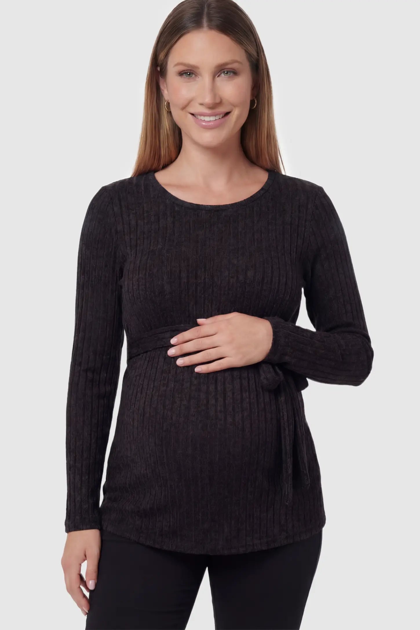 Ribbed Tie-Waist Long Sleeve Maternity Top Ribbed Tie-Waist Long Sleeve Maternity Top in Black featuring an adjustable waist on a pregnant model showing front.