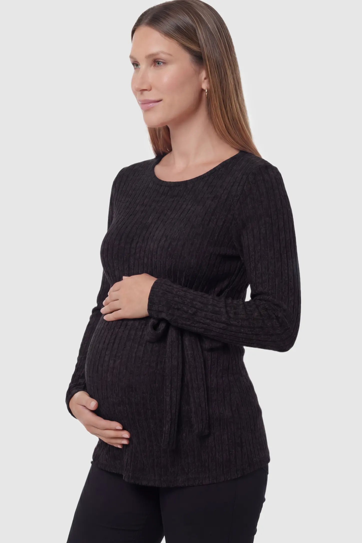 Ribbed Tie-Waist Long Sleeve Maternity Top Ribbed Tie-Waist Long Sleeve Maternity Top in Black featuring an adjustable waist on a pregnant model showing side.