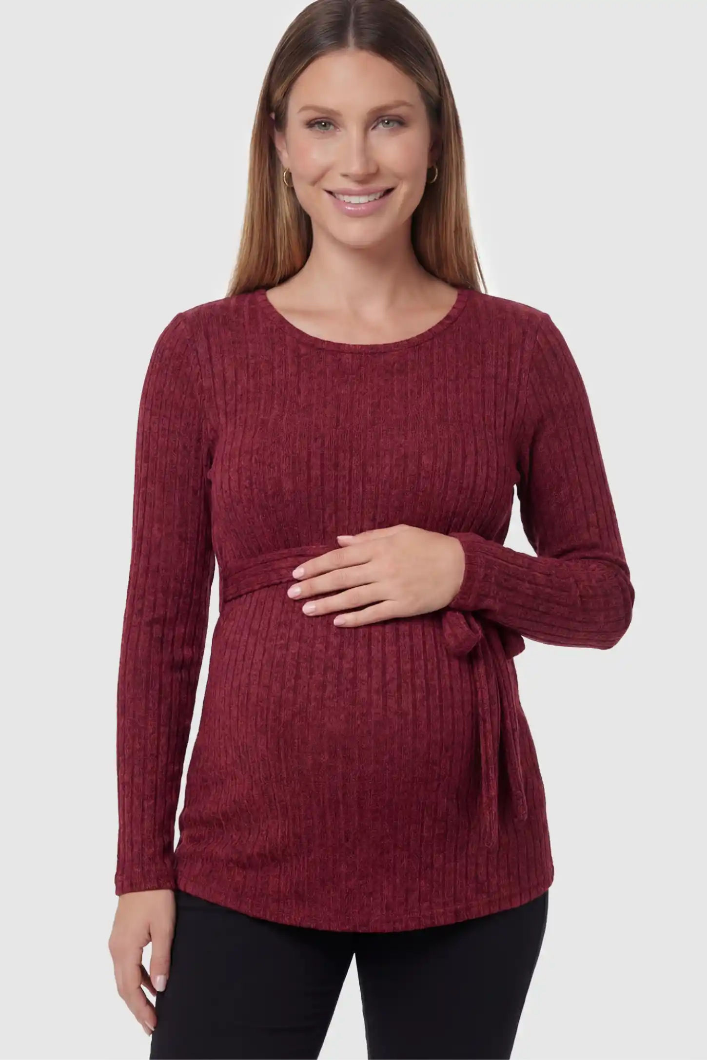Ribbed Tie-Waist Long Sleeve Maternity Top Ribbed Tie-Waist Long Sleeve Maternity Top in red featuring an adjustable waist on a pregnant model showing front.