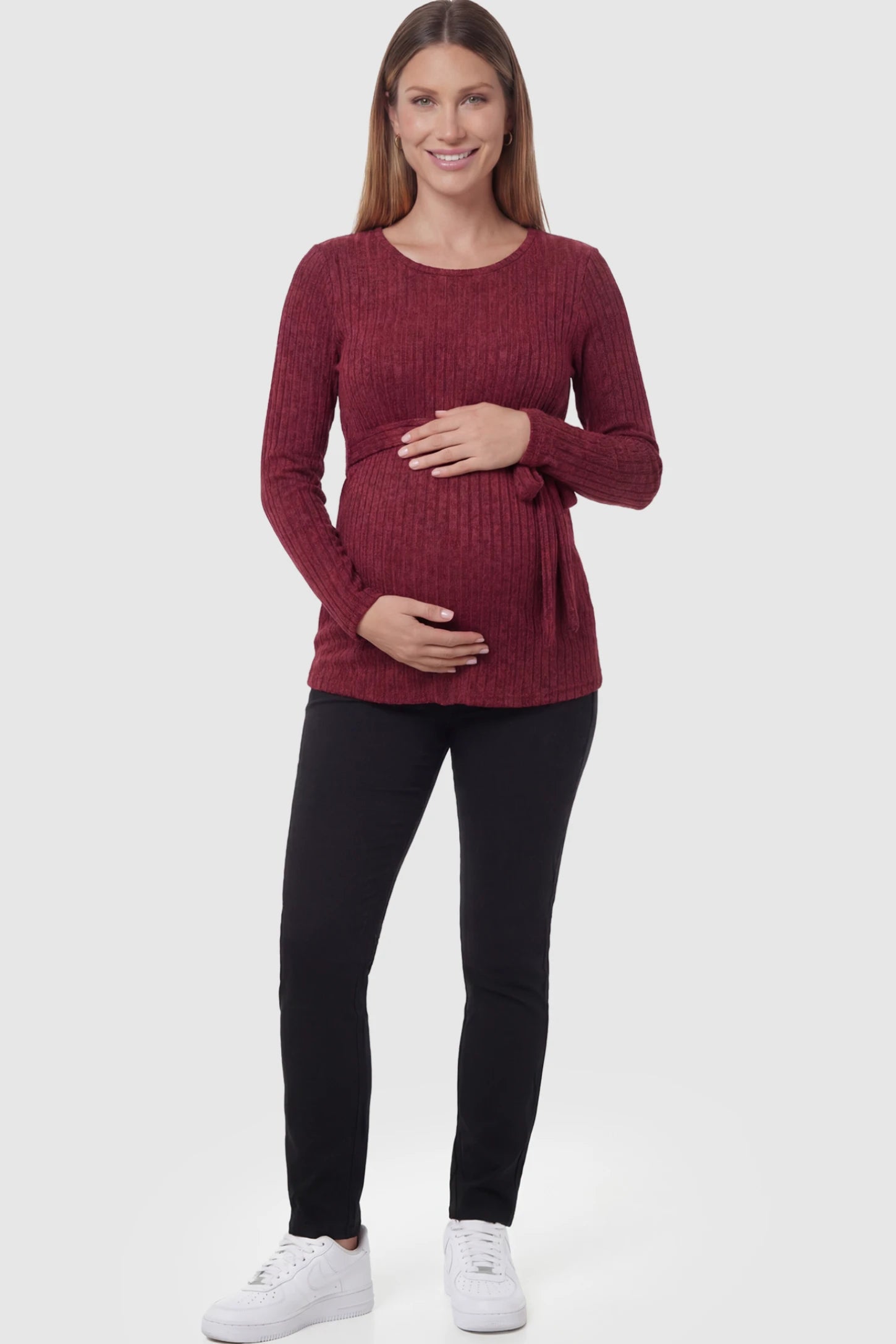 Ribbed Tie-Waist Long Sleeve Maternity Top Ribbed Tie-Waist Long Sleeve Maternity Top in Red featuring an adjustable waist on a pregnant model.