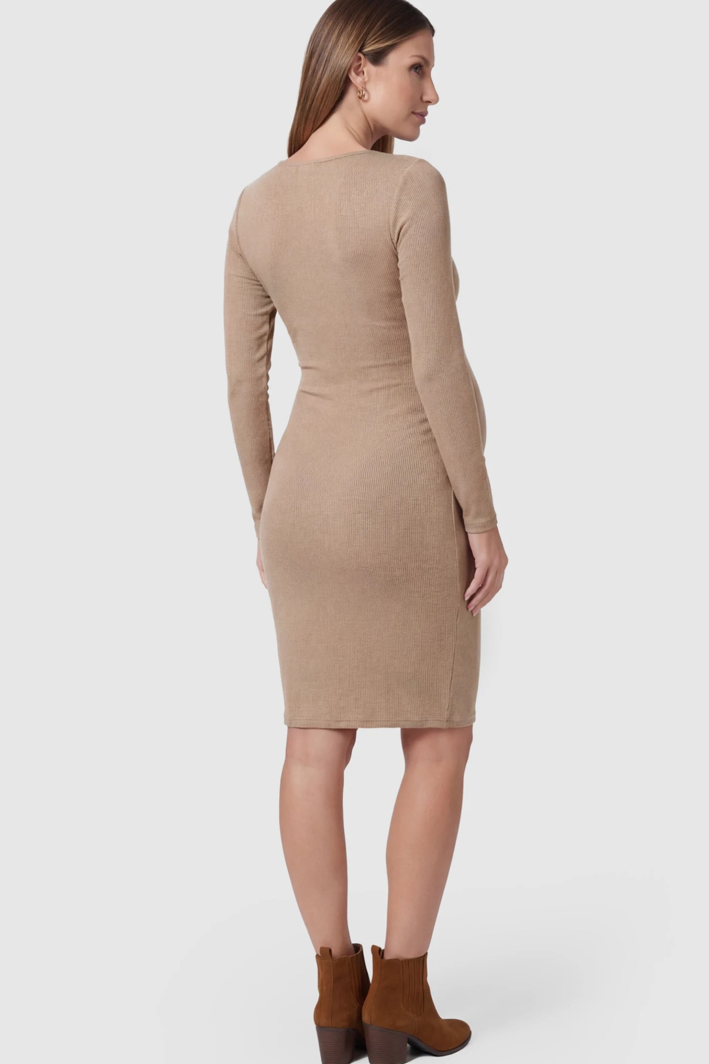 Ribbed Twist Front Long Sleeve Bodycon Maternity Short Dress Twist-Front Long Sleeve Ribbed Maternity Mini Dress in Beige featuring a textured knit finish on a pregnant model showing back.