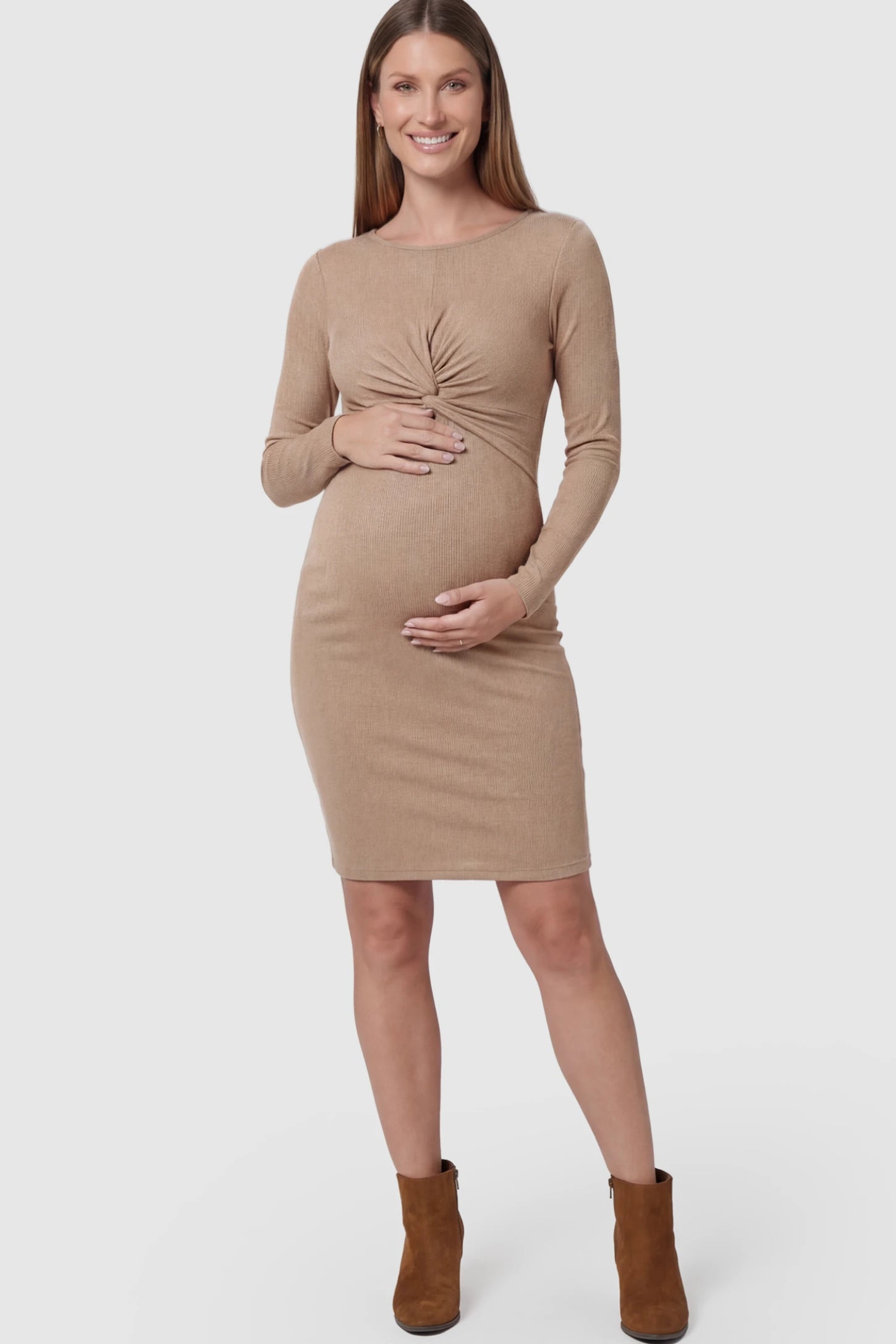 Ribbed Twist Front Long Sleeve Bodycon Maternity Short Dress Twist-Front Long Sleeve Ribbed Maternity Mini Dress in Beige featuring a textured knit finish on a pregnant model showing front.