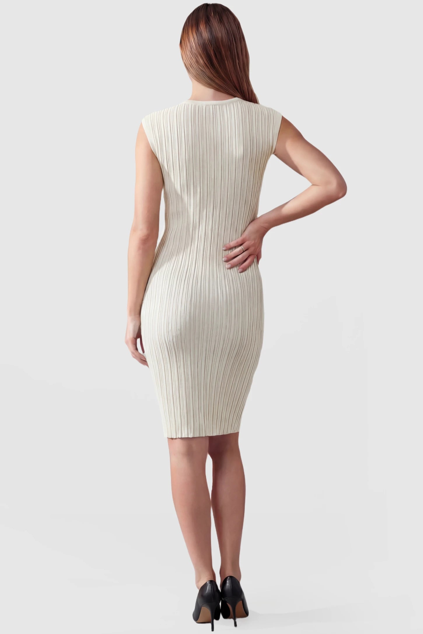 Ribbed V-Neck Bodycon Maternity Short Dress Ribbed V-Neck Bodycon Maternity Short Dress in Beige featuring a ribbed bodycon texture and sleeveless V-neck on a pregnant model, back view.