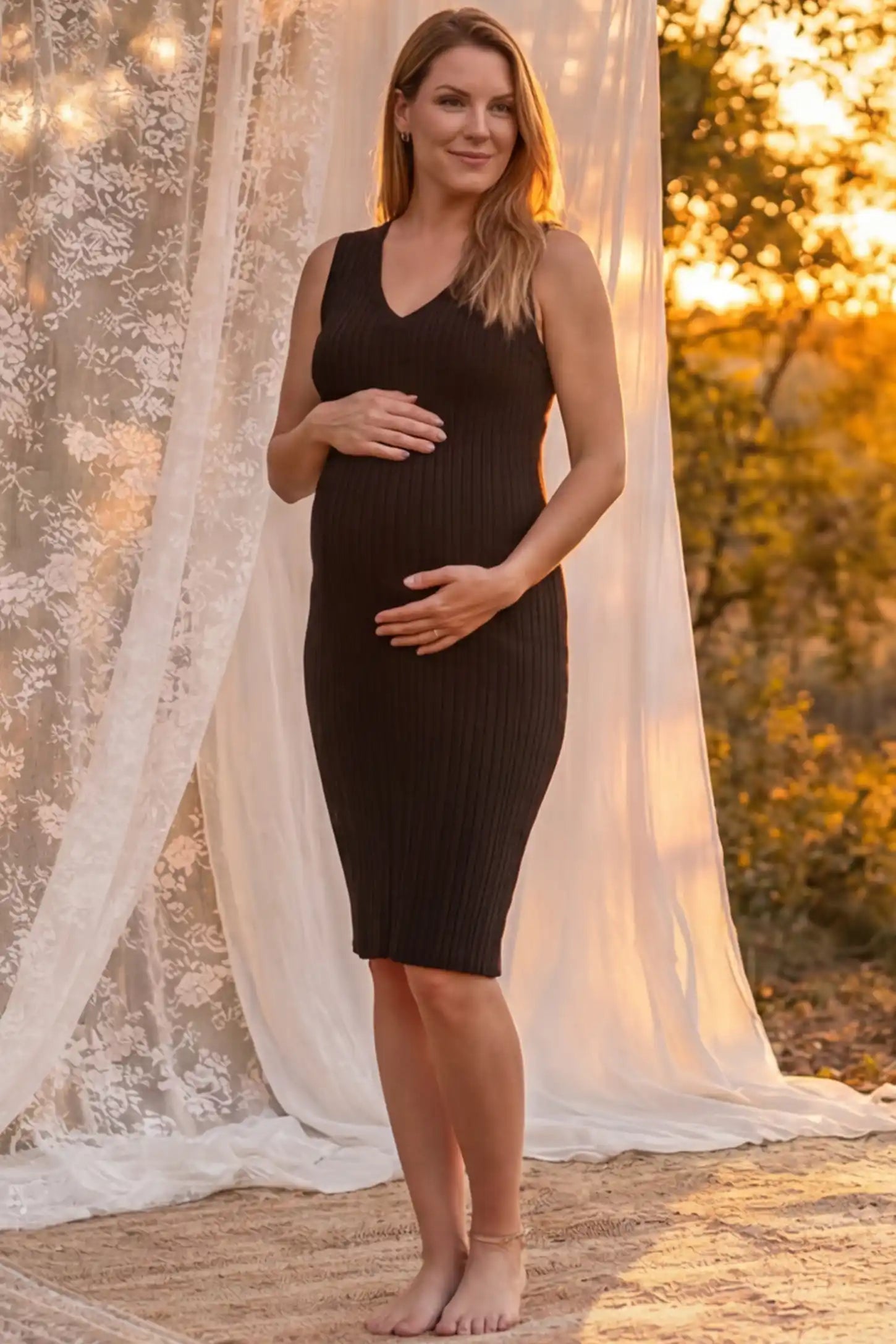 Ribbed V-Neck Bodycon Maternity Short Dress Ribbed V-Neck Bodycon Maternity Short Dress in Black featuring a ribbed bodycon texture and sleeveless V-neck on a pregnant model in outdoor setting, front view.